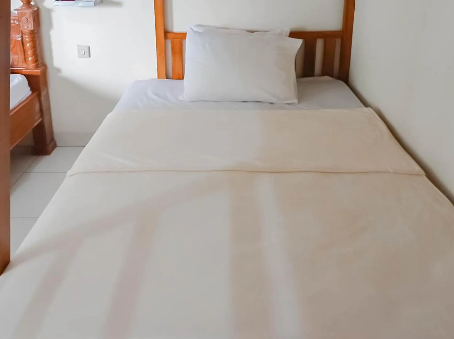 Bed in Penginapan Al Firdausi Syariah Mitra RedDoorz