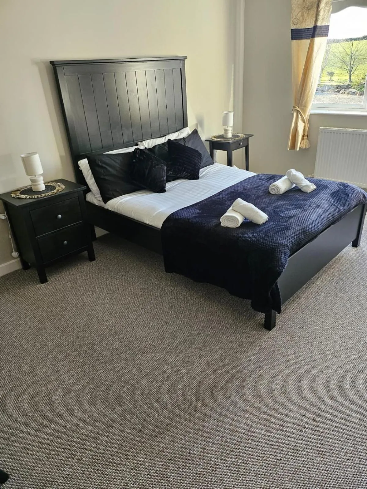 Bed in Walsh's Mill Lodges & Linen House