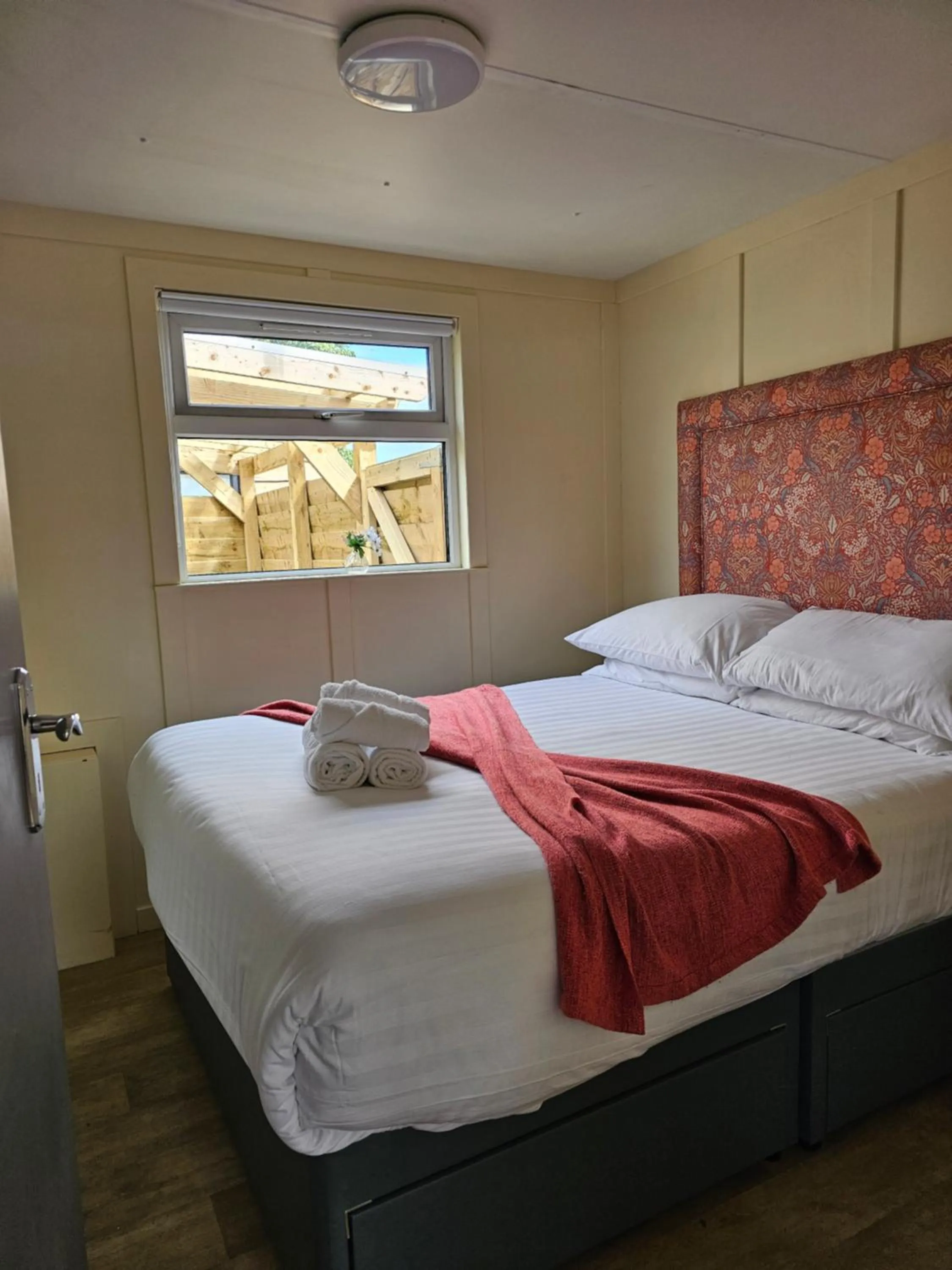 Bed in Walsh's Mill Lodges & Linen House