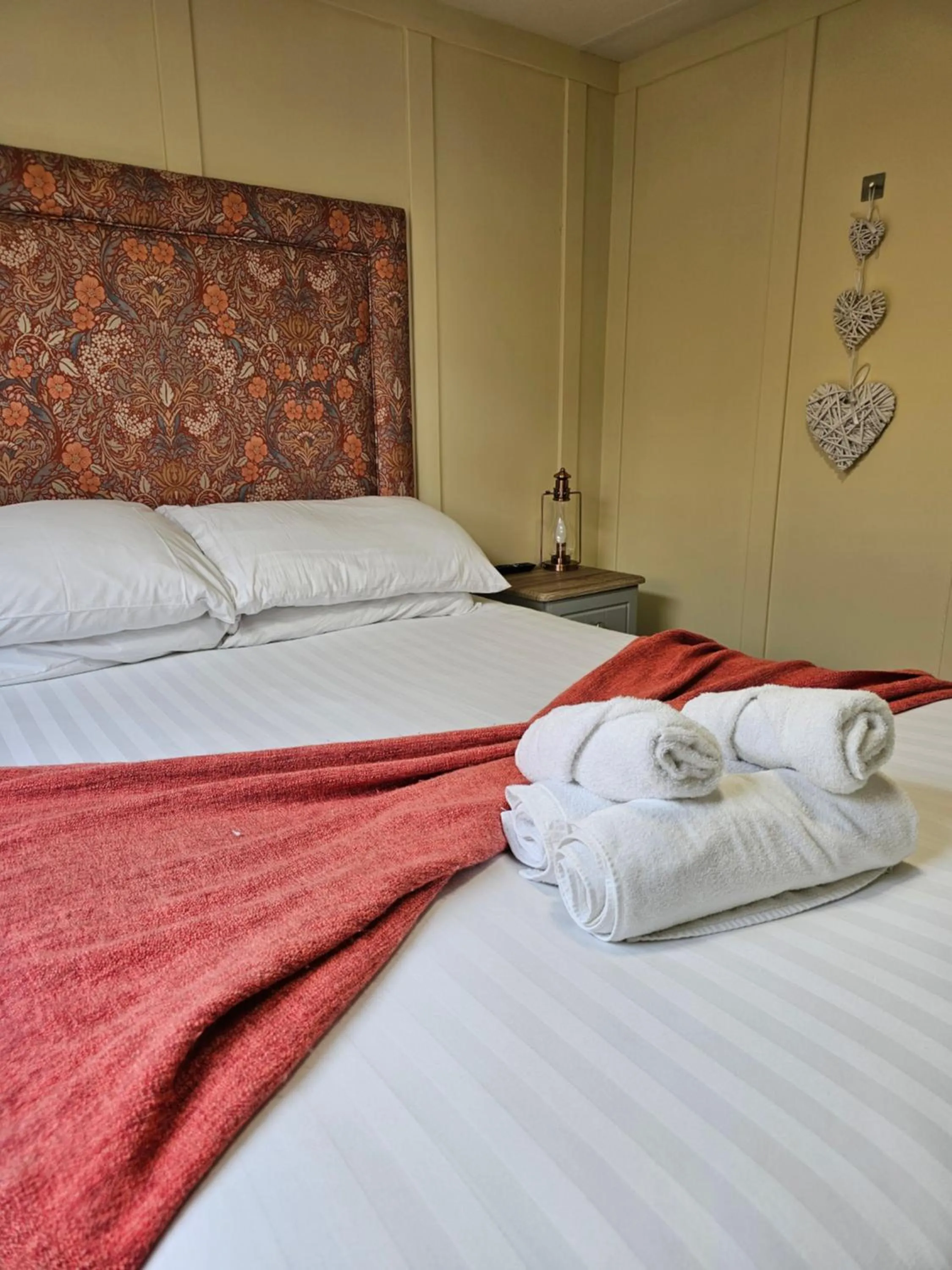 Bed in Walsh's Mill Lodges & Linen House