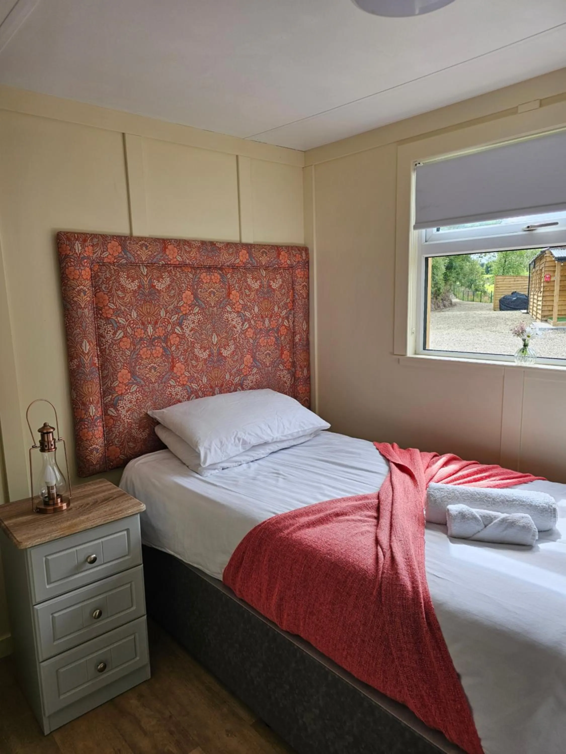 Bed in Walsh's Mill Lodges & Linen House