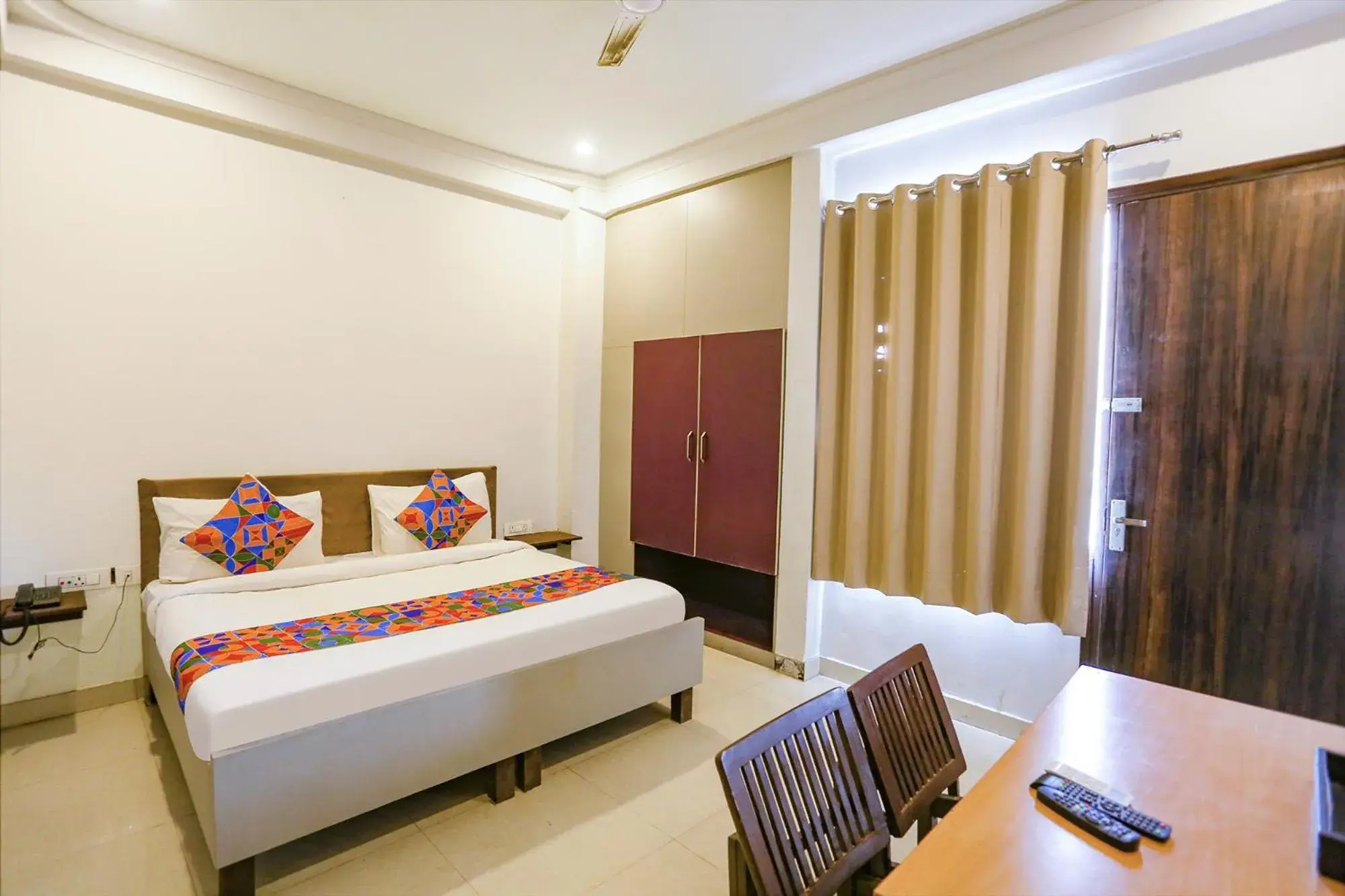 Living room, Bed in FabExpress Novel Suites - Nr Yashobhoomi Convention Centre Living room, Bed in FabExpress Novel Suites - Nr Yashobhoomi Convention Centre