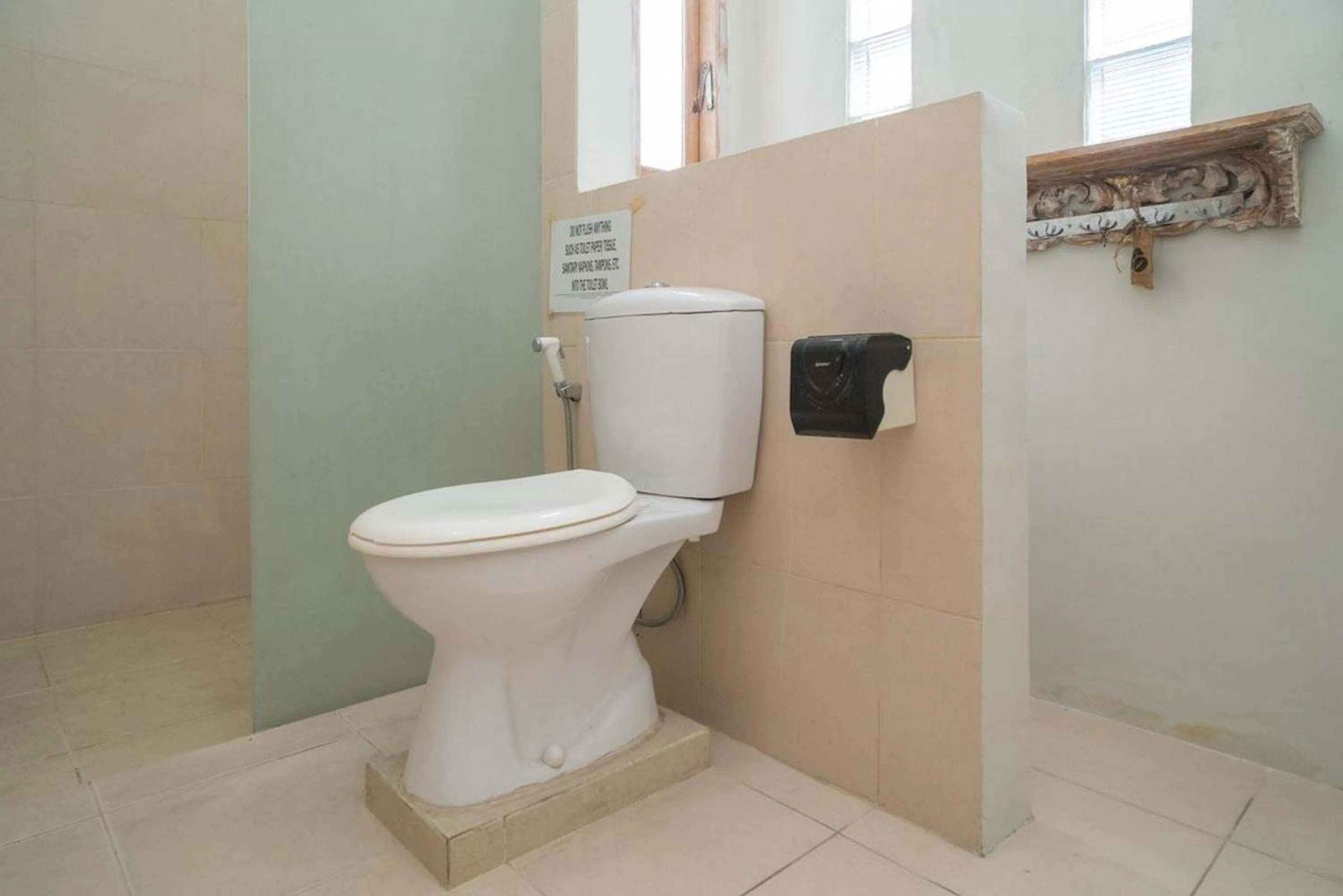 Bathroom in Urbanview Hotel Wayan Mansion