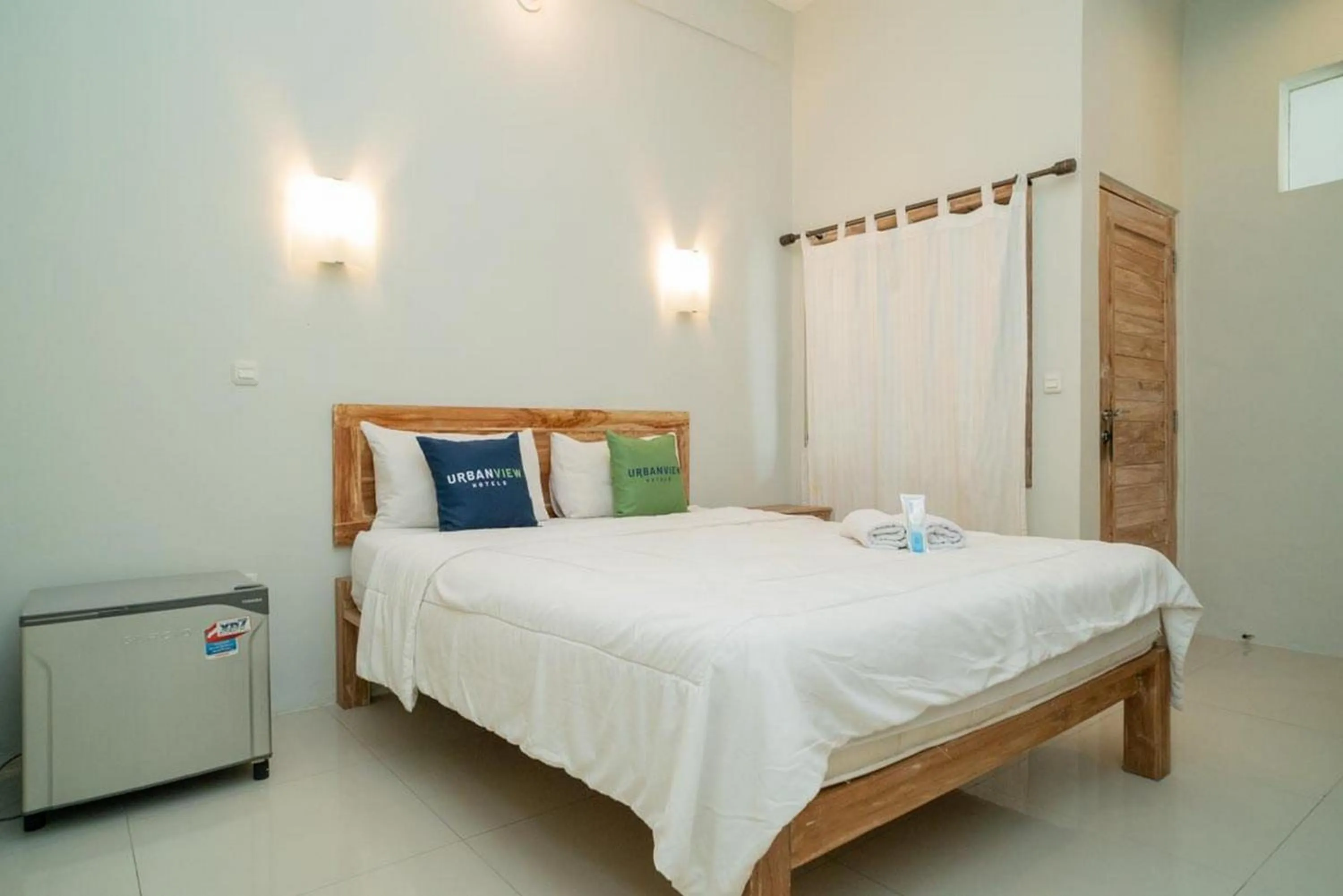 Bedroom, Bed in Urbanview Hotel Wayan Mansion