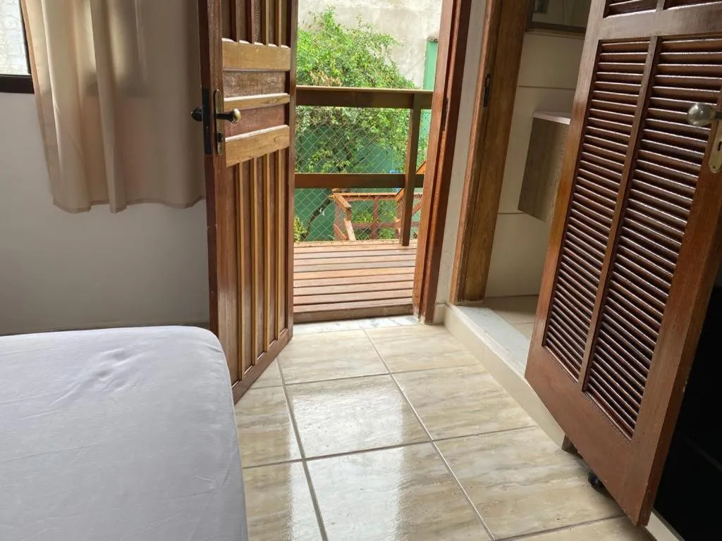 Bed in Pousada Casa de mãe aconchegante com piscina próximo à praia