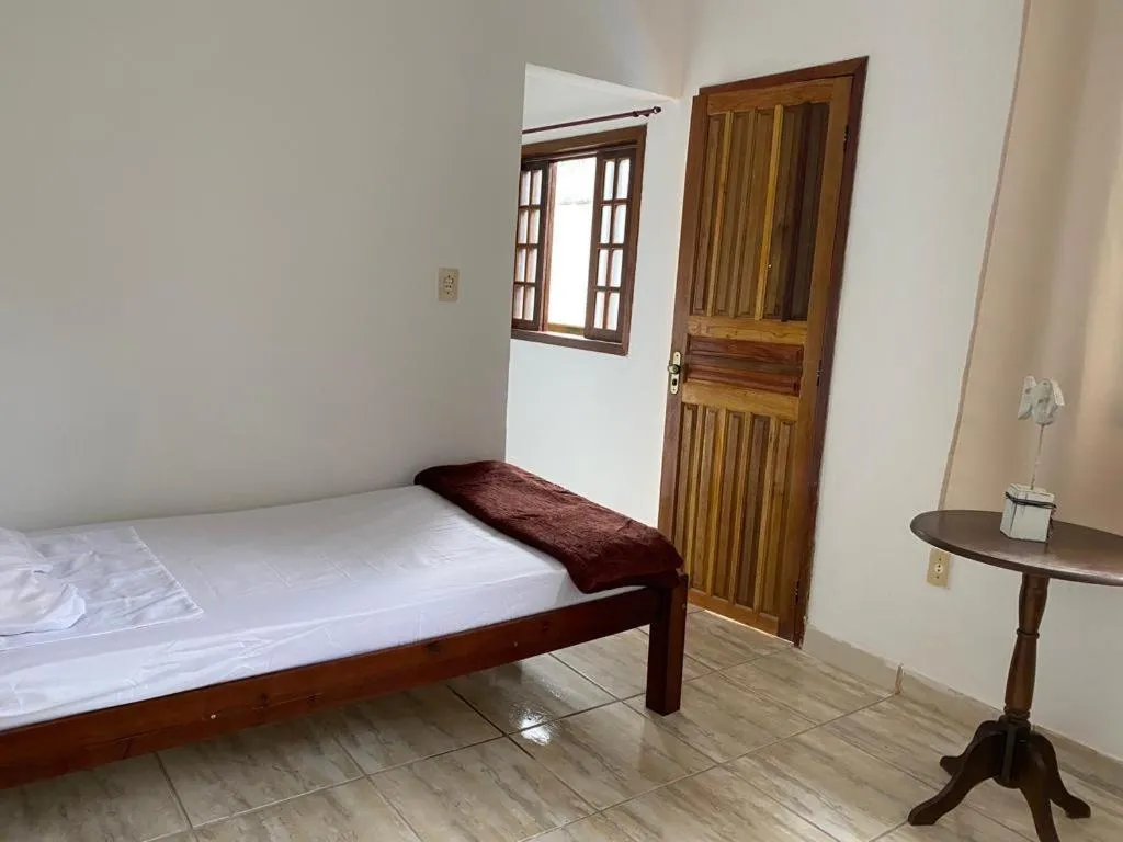 Bed in Pousada Casa de mãe aconchegante com piscina próximo à praia