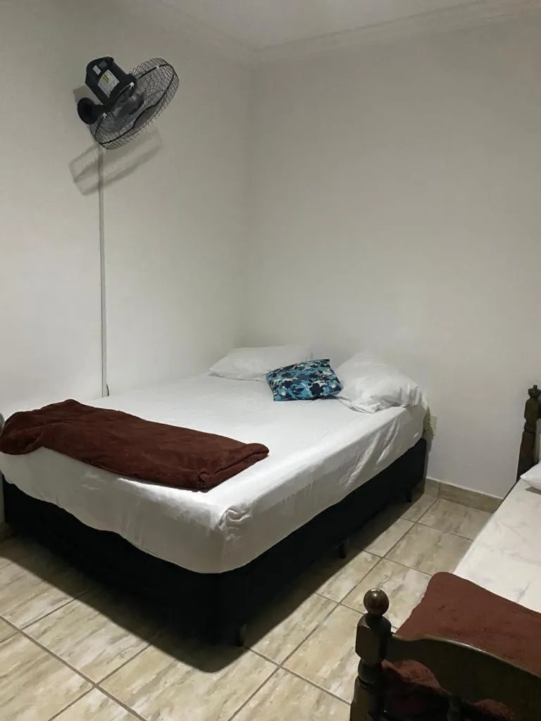 Bed in Pousada Casa de mãe aconchegante com piscina próximo à praia