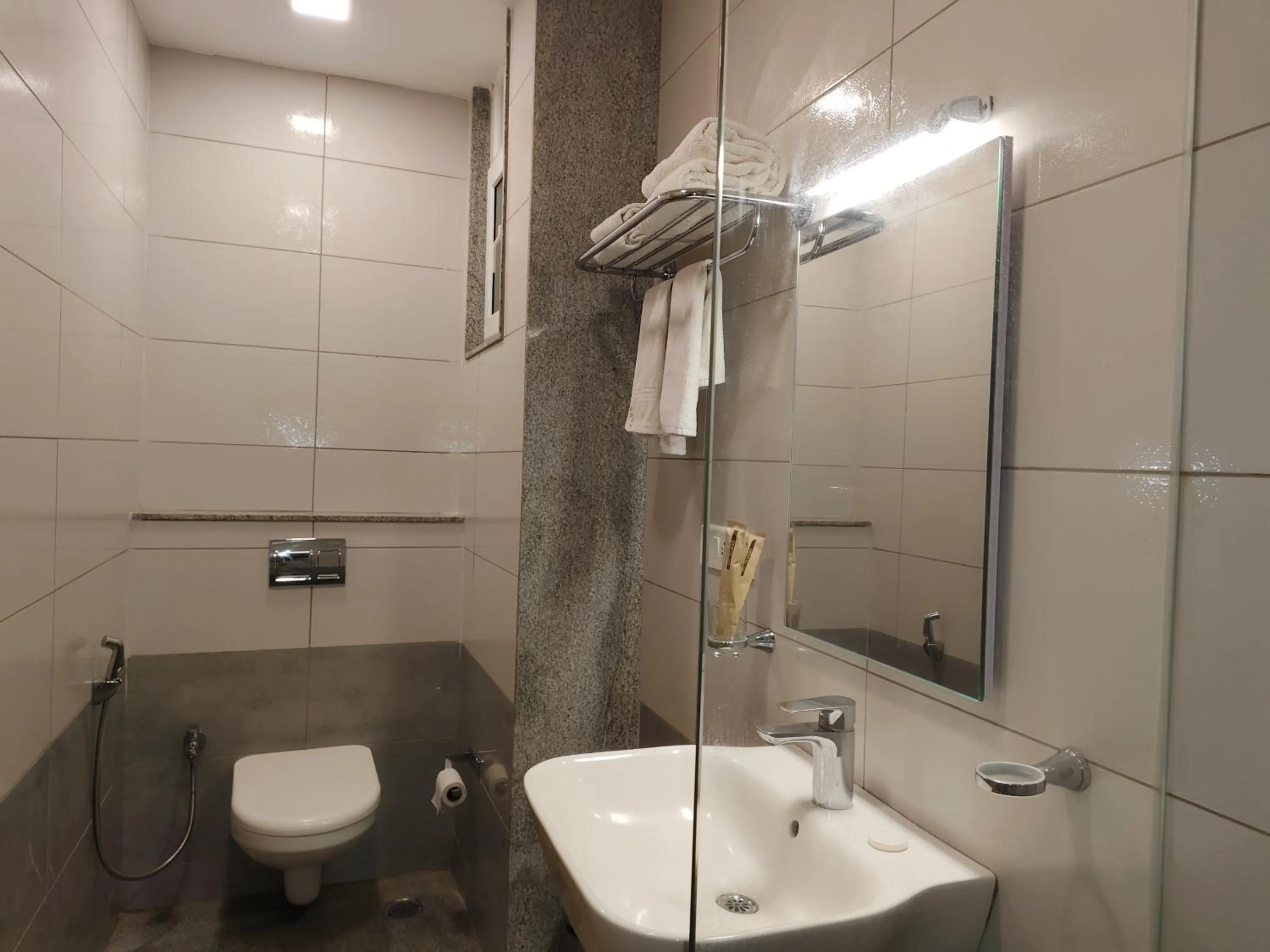 Toilet in Hotel Aura by Woco Stays