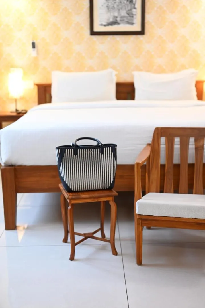 Bed in Hotel Aura by Woco Stays