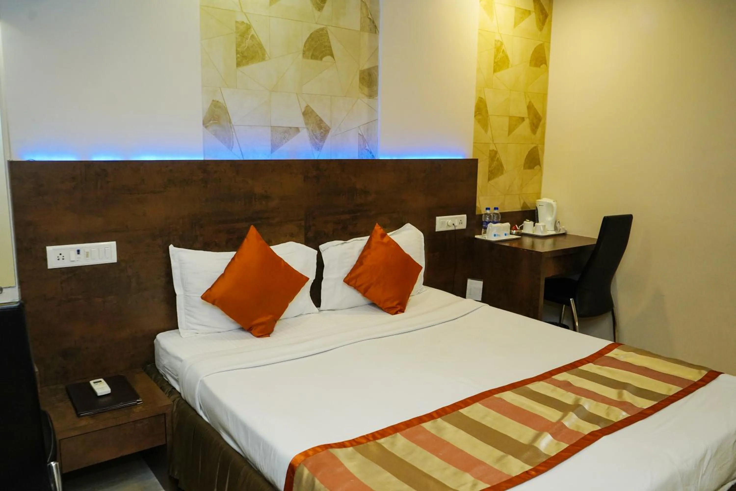 Bed in Hotel Spices Navi Mumbai