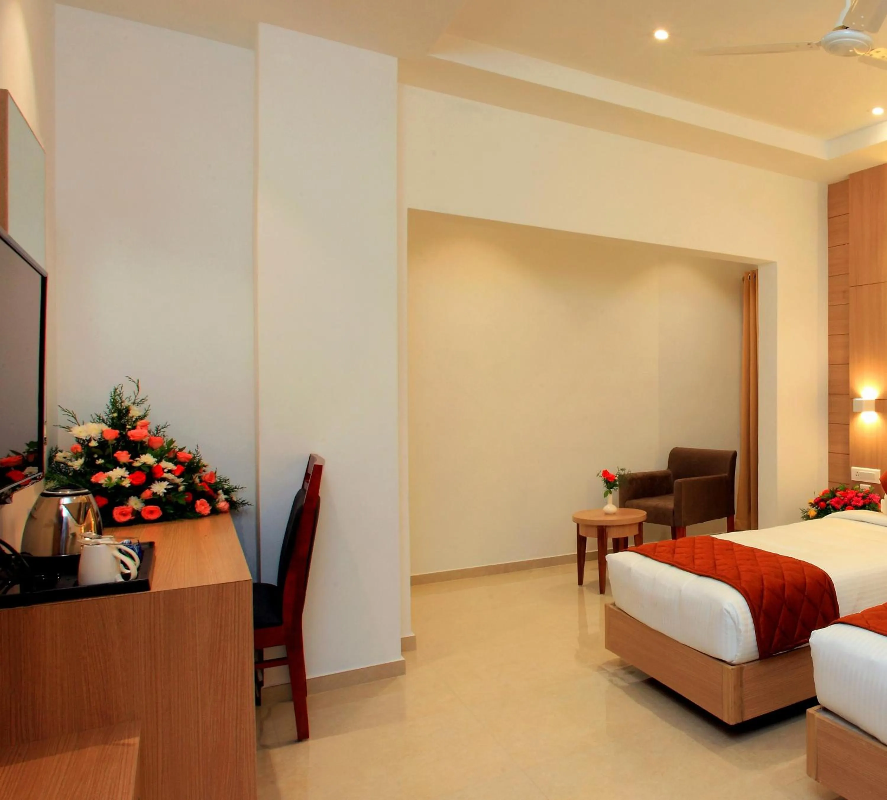 Seating area, Bed in RAAS Residency