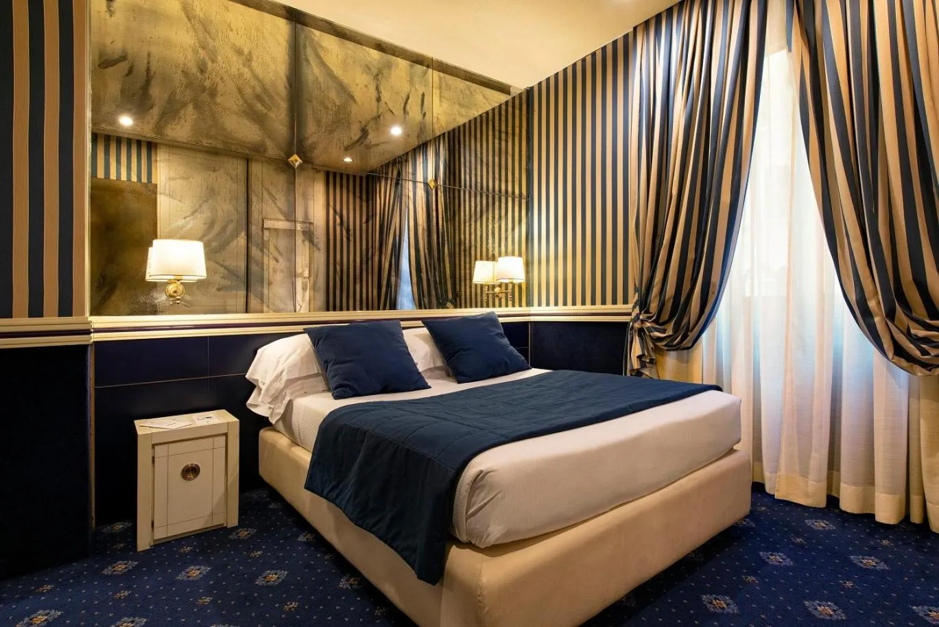 Bed in Atlante Star Hotel