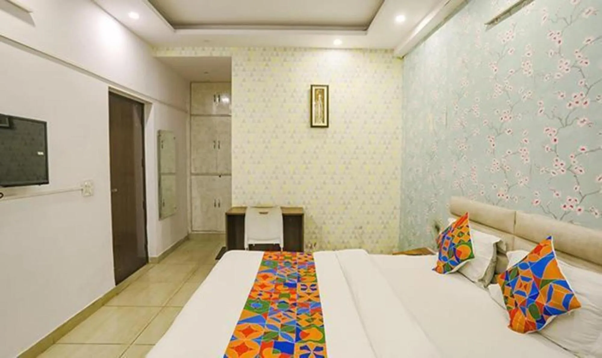 Bed in FabHotel Comfirt Inn