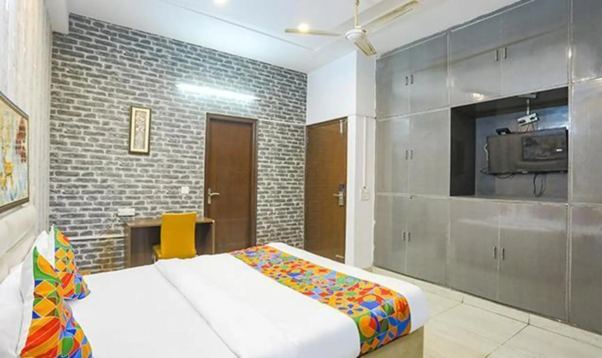 Bed in FabHotel Comfirt Inn