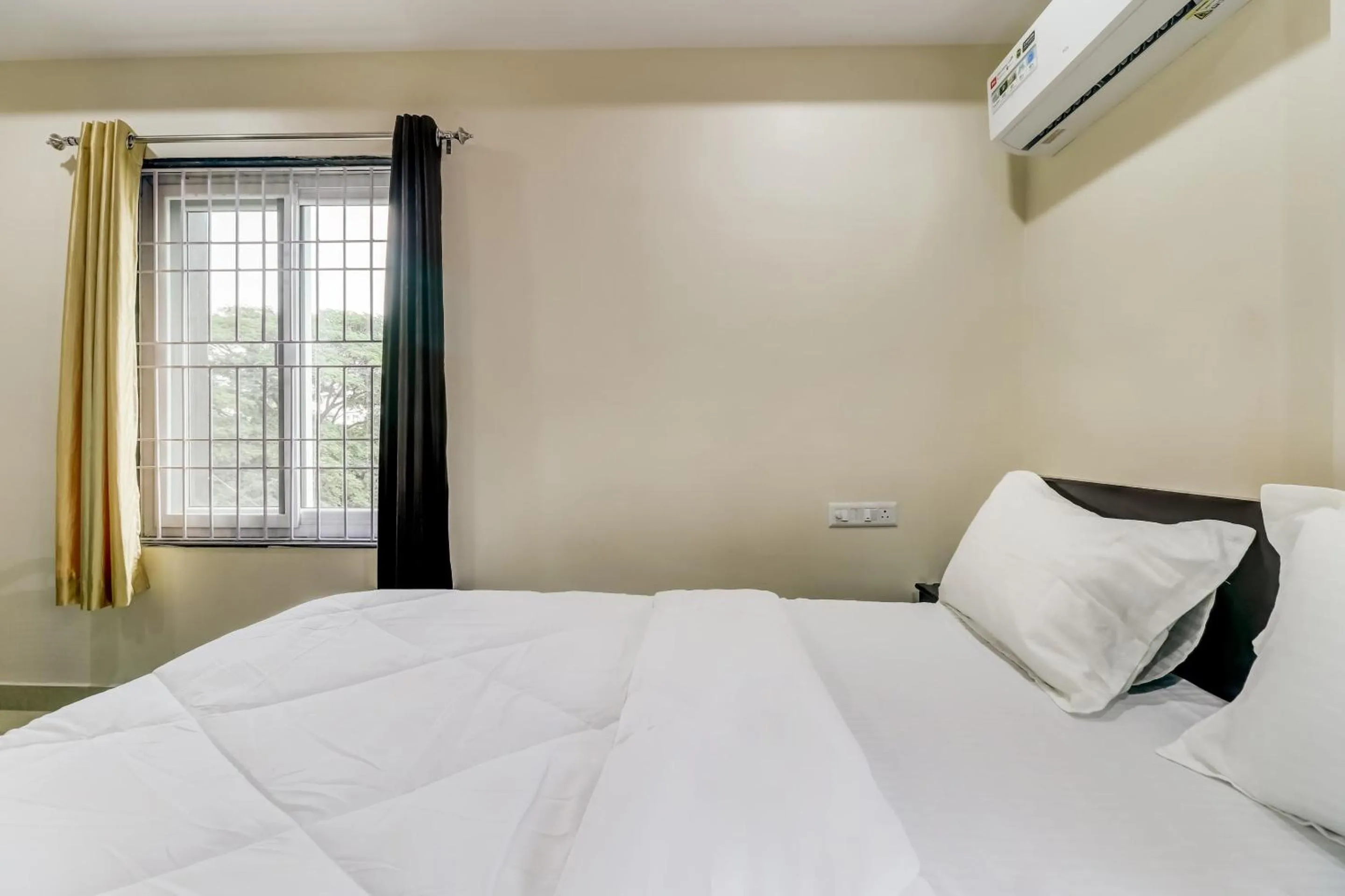 Bedroom in Hotel O Sri Singampalli Residency