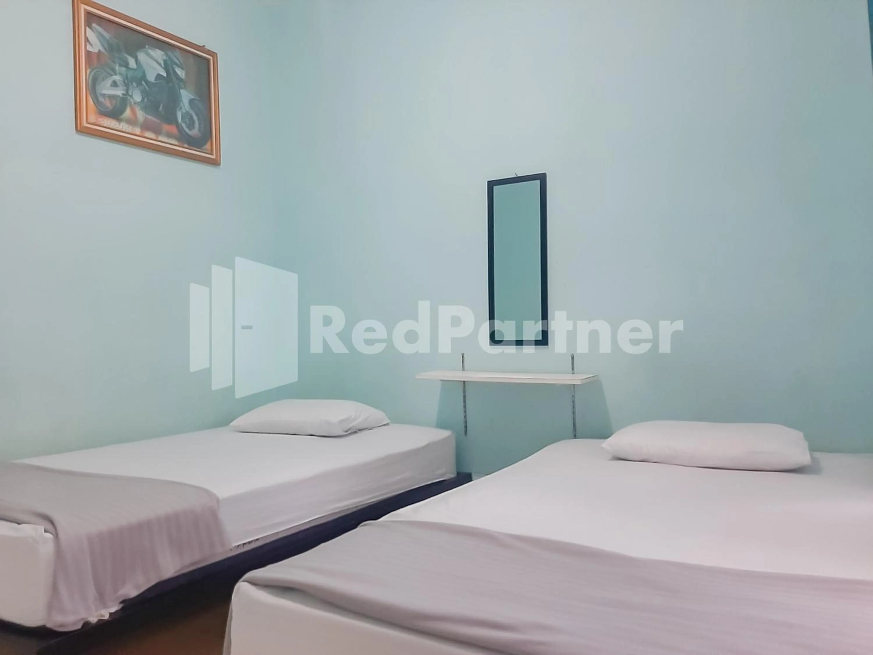 Bed in Syariah Safar Guest House Mitra RedDoorz