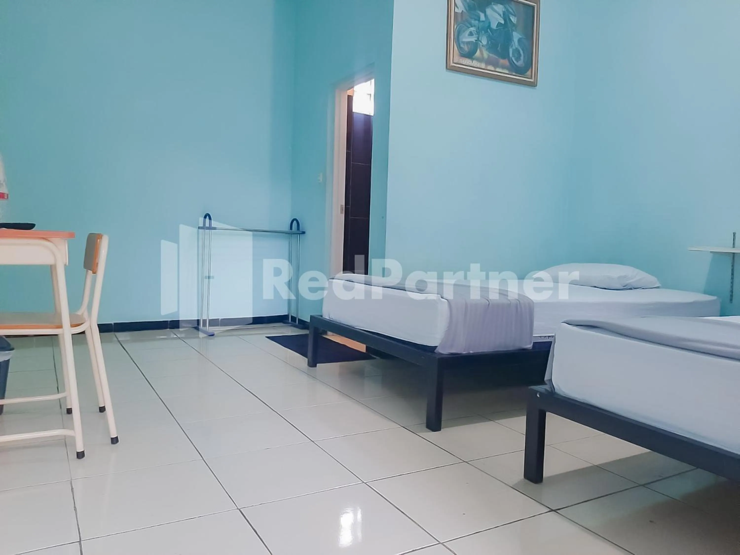 Bed in Syariah Safar Guest House Mitra RedDoorz