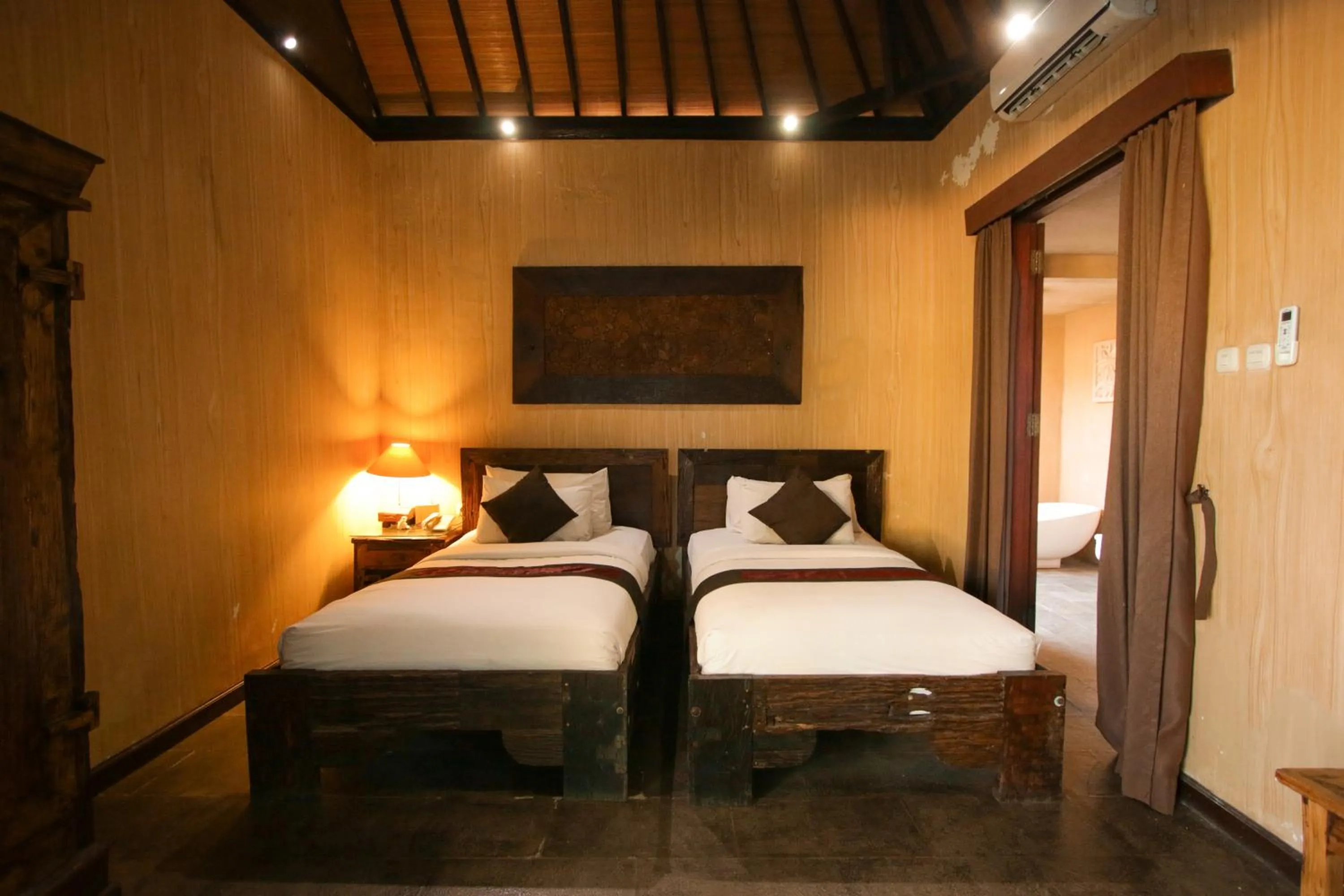 Bed in Gino Feruci Villa Ubud by KAGUM Hotels
