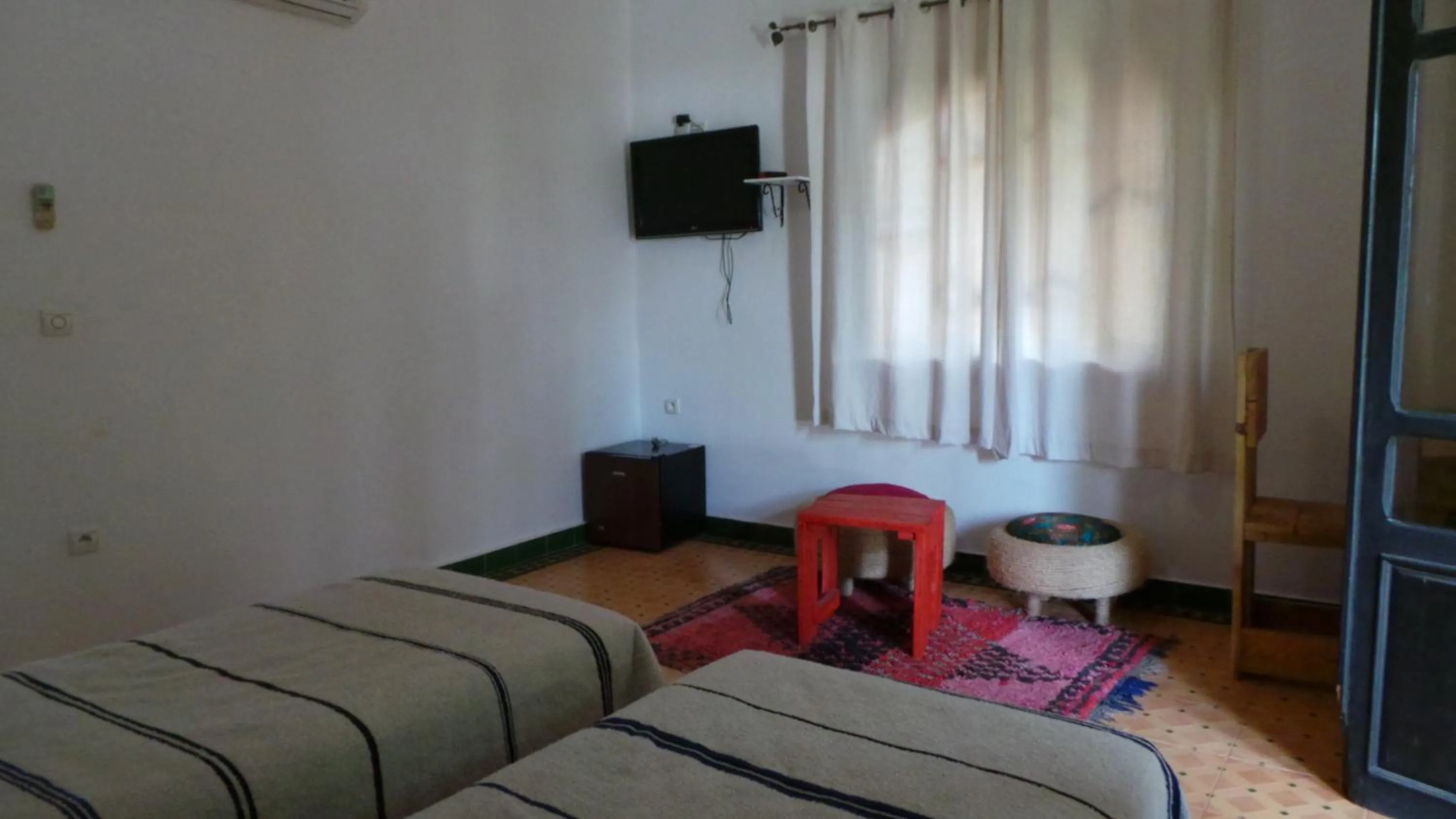 Photo of the whole room, Bed in Targafit Hotel & Hammam