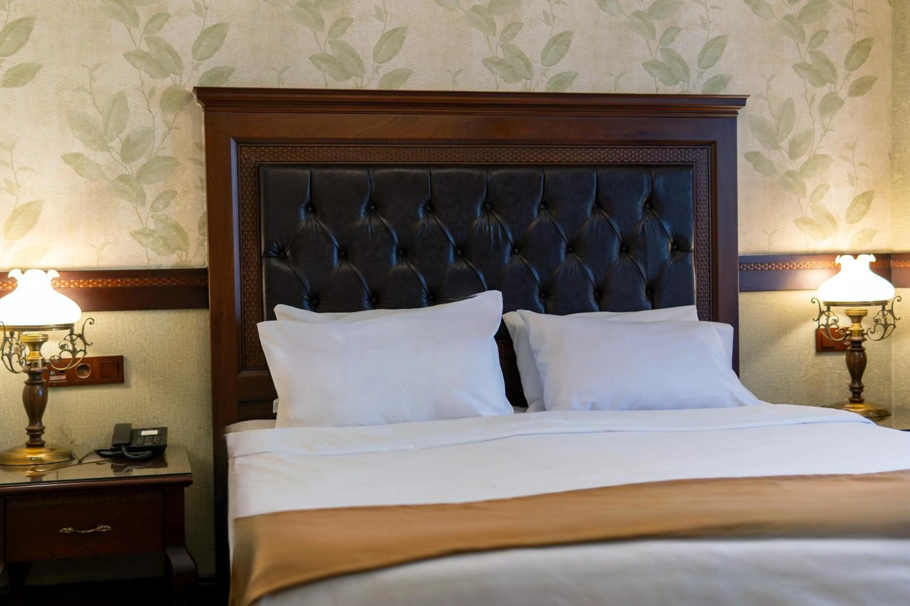 Bed in La Vida Old City Hotel