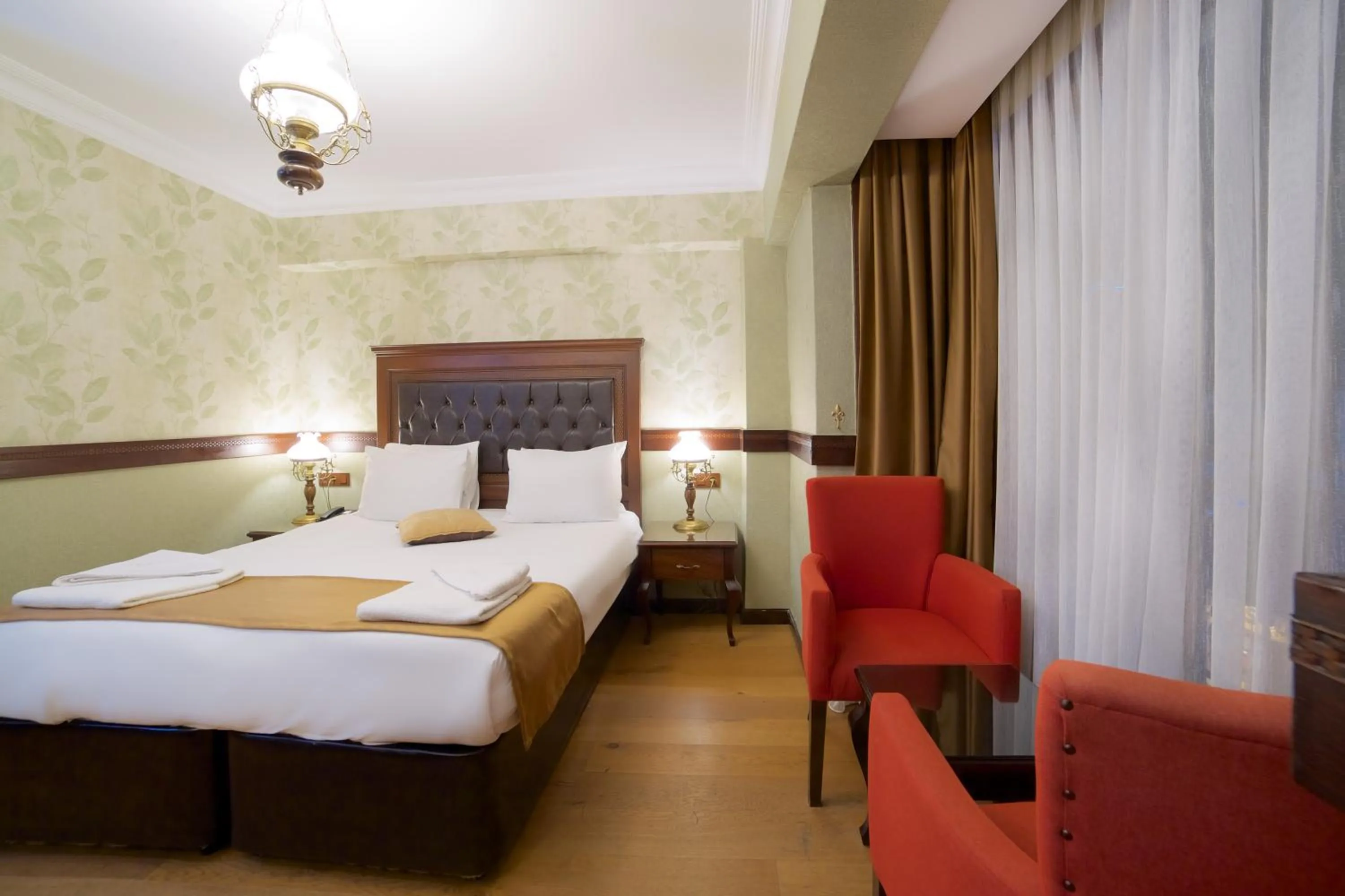 Bed in La Vida Old City Hotel