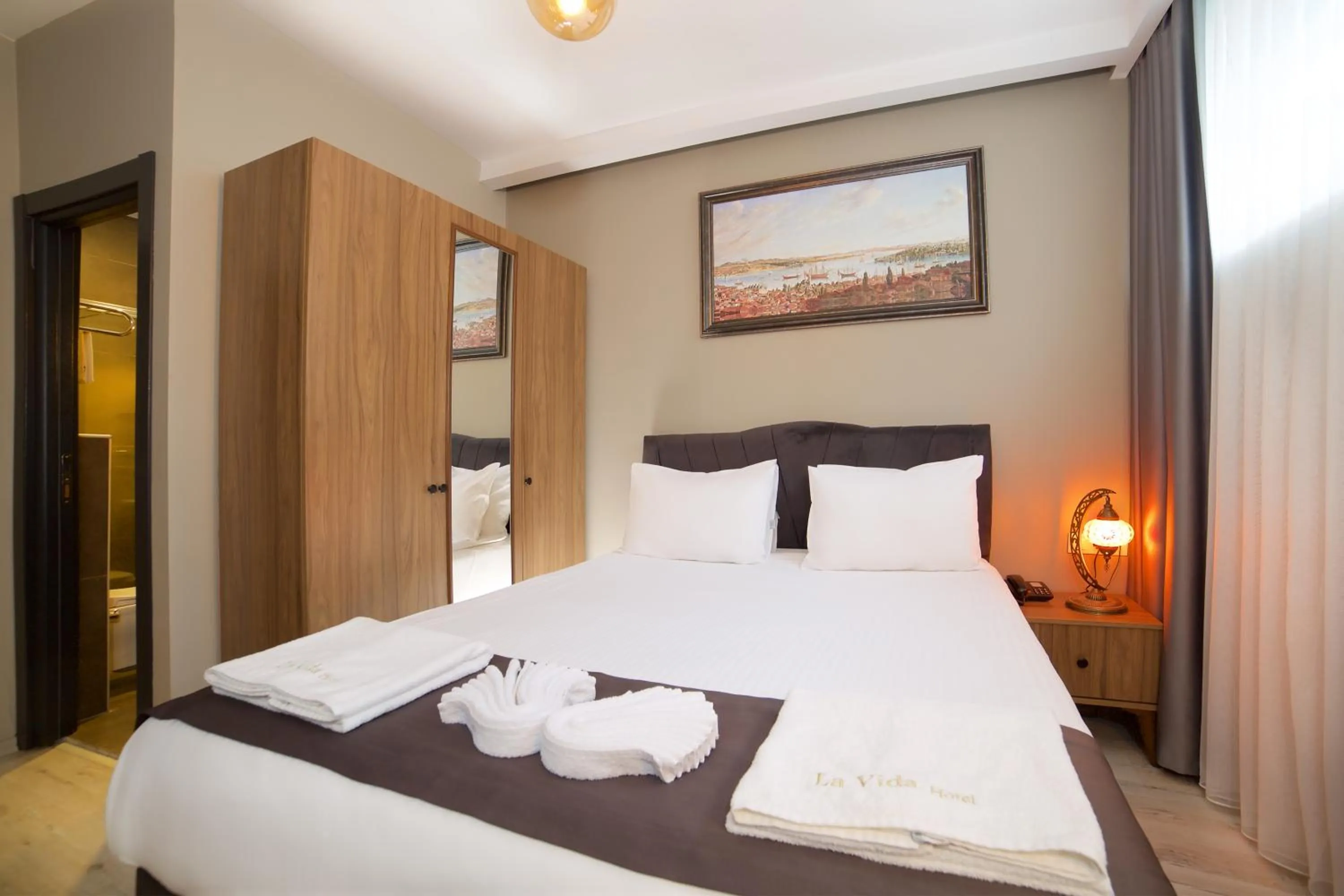 Bed in La Vida Old City Hotel