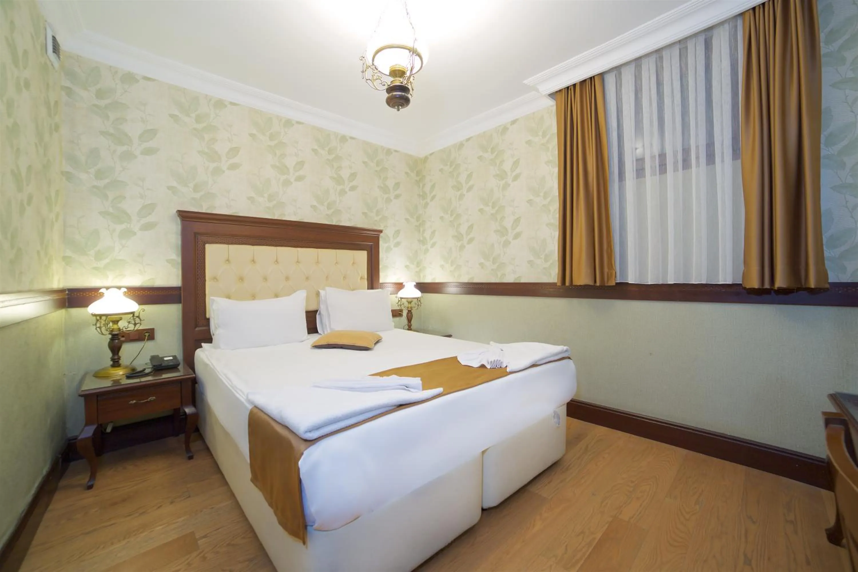 Bed in La Vida Old City Hotel