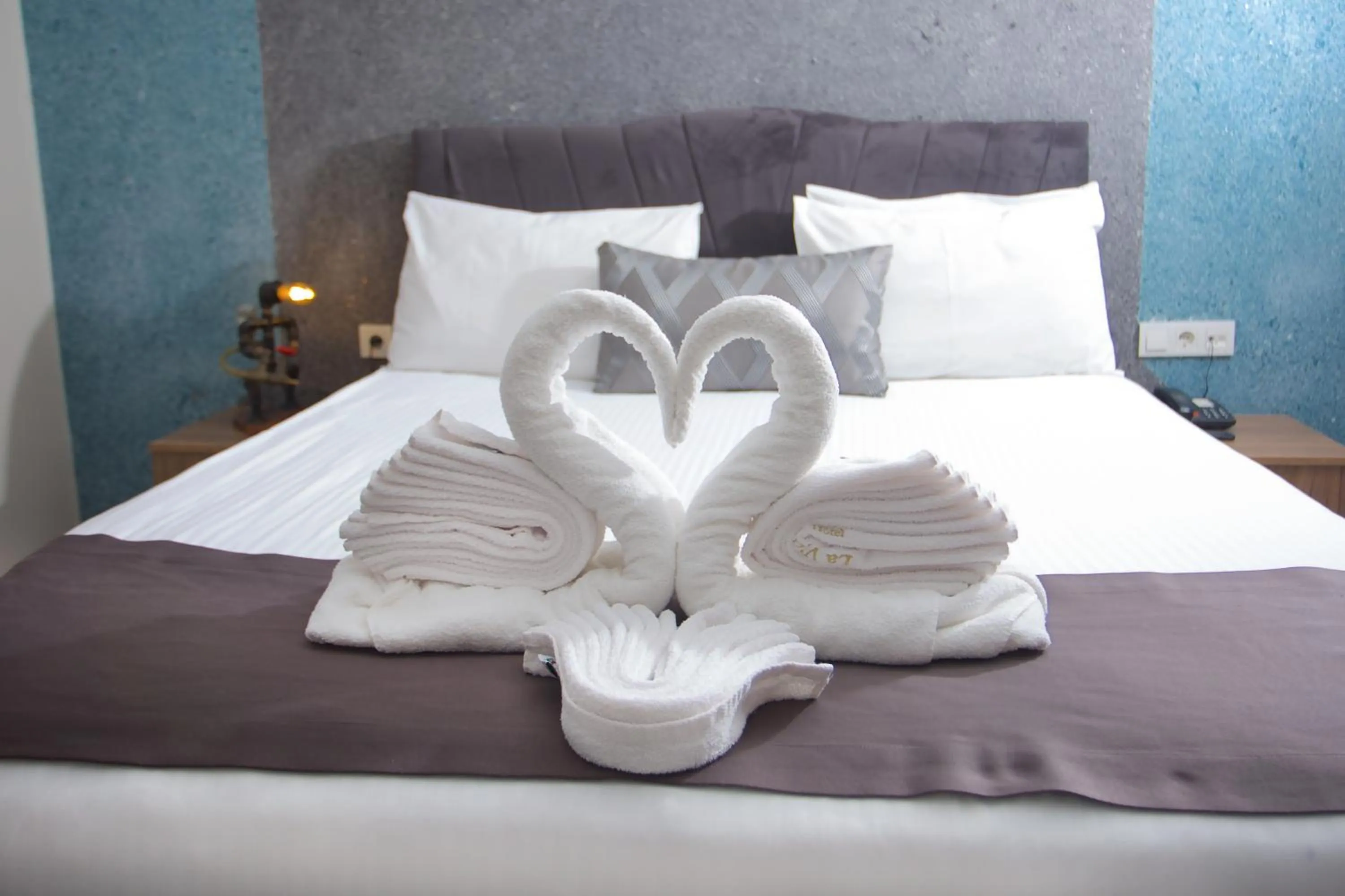 Bed in La Vida Old City Hotel