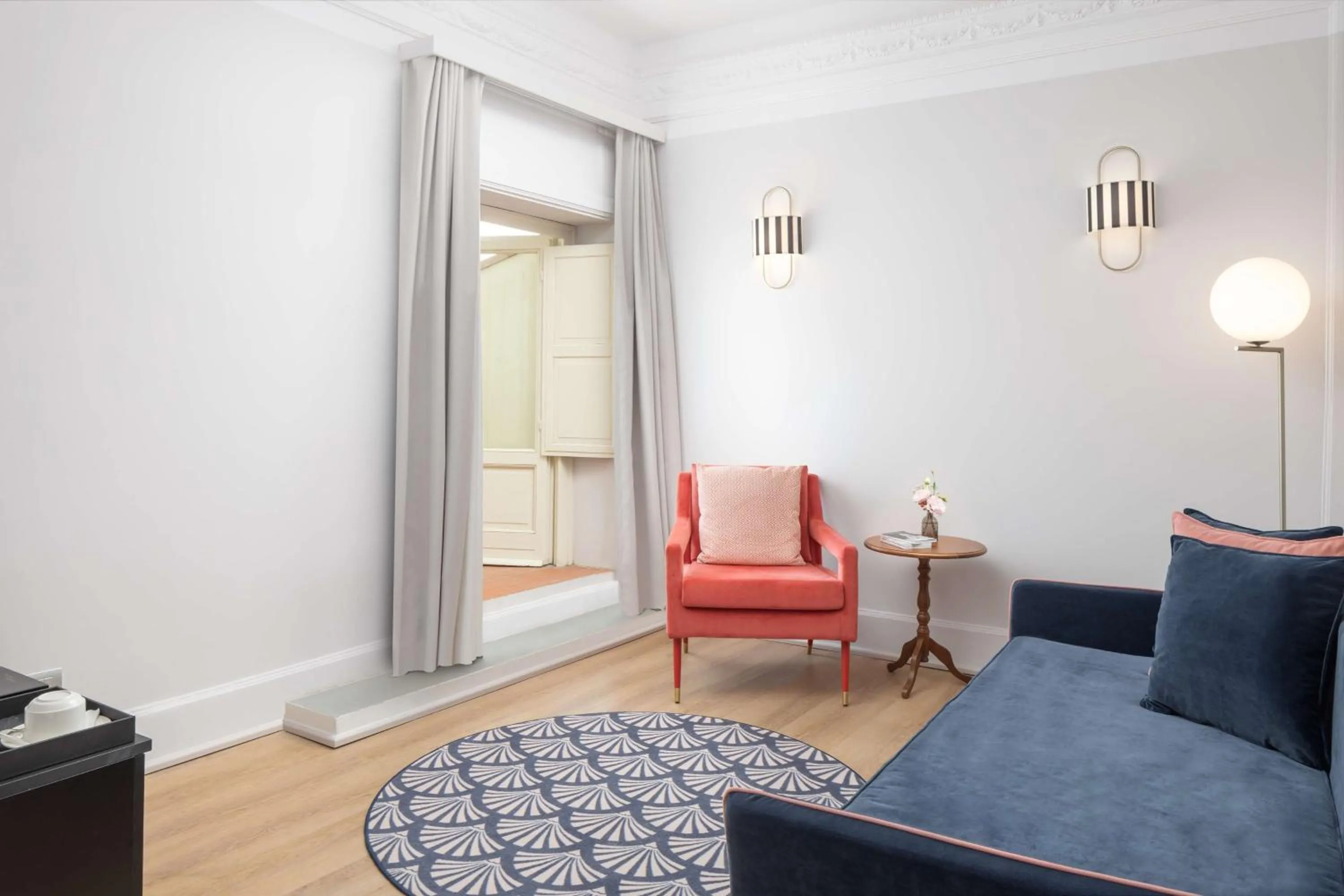 Living room in Anglo American Hotel Florence, Curio Collection By Hilton