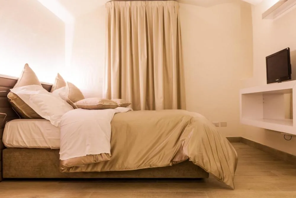 Bed in Palazzo dei Ciompi Suites