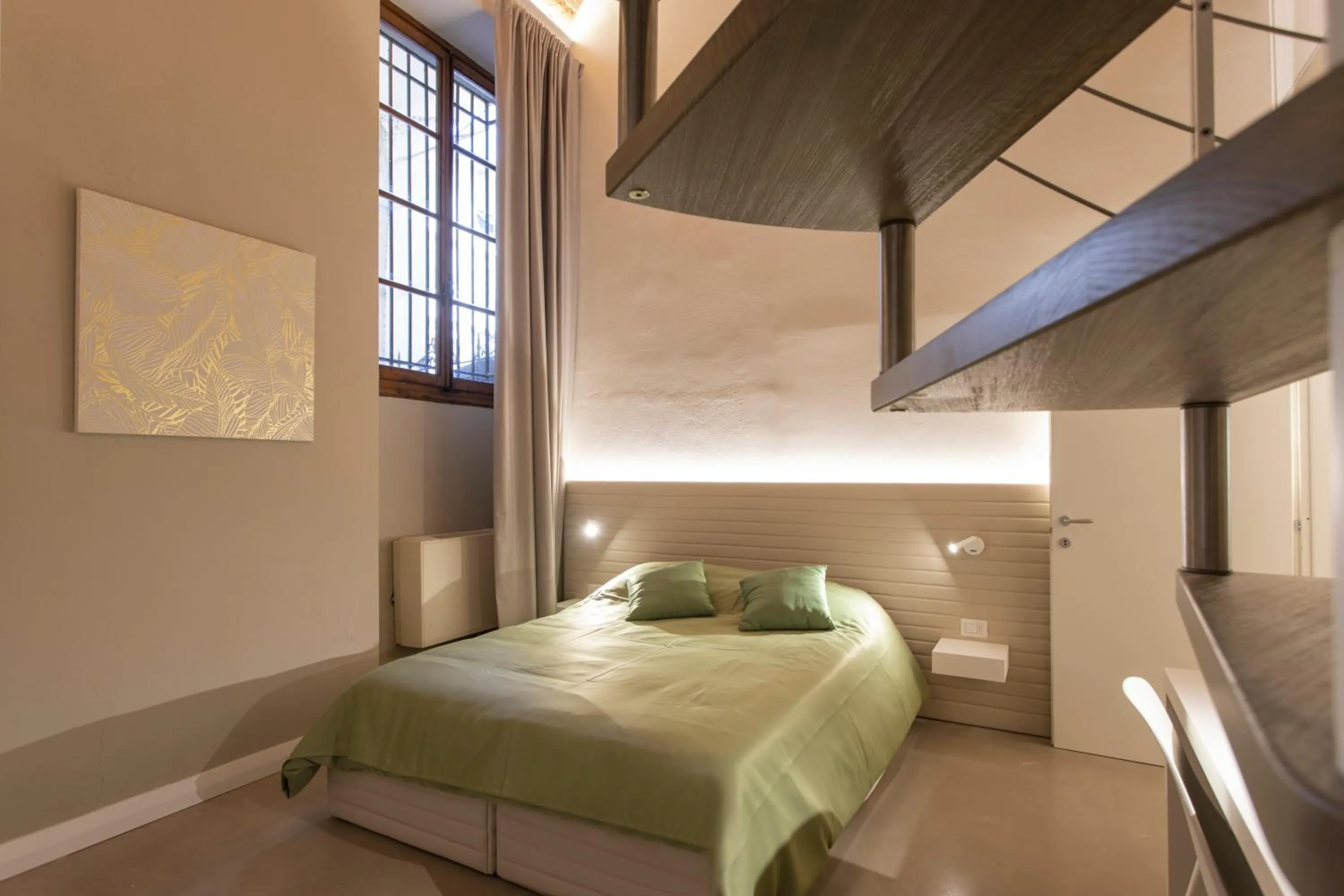 Bed in Palazzo dei Ciompi Suites