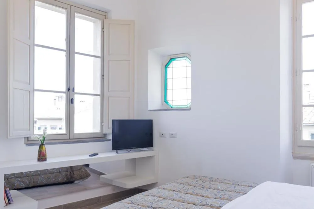 Bed in Palazzo dei Ciompi Suites