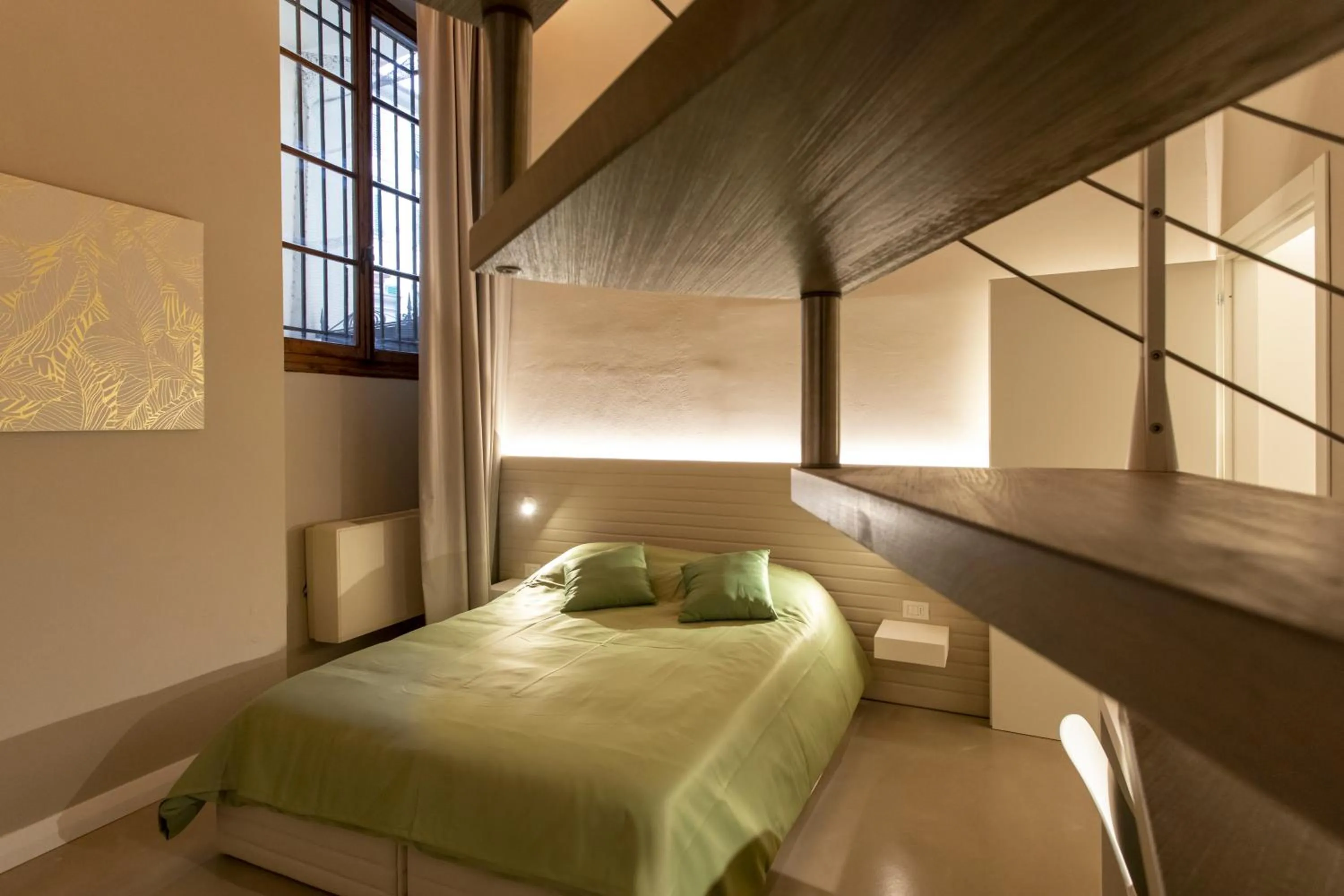 Bed in Palazzo dei Ciompi Suites