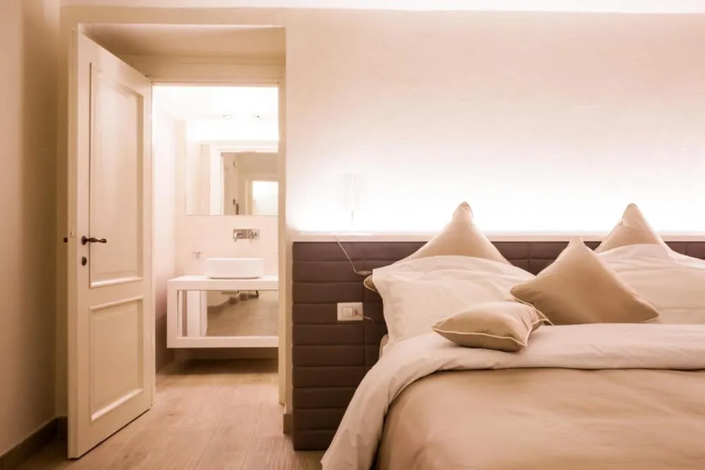 Bed in Palazzo dei Ciompi Suites