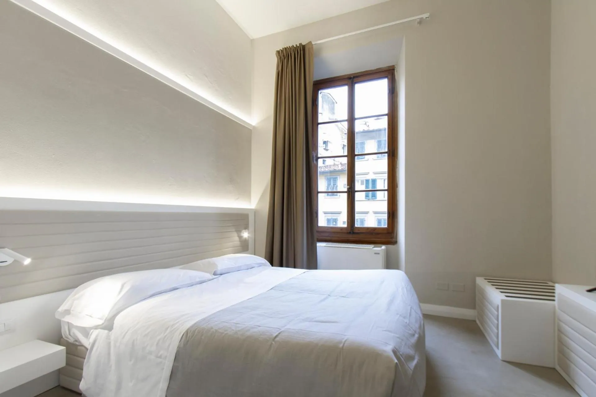 Bed in Palazzo dei Ciompi Suites