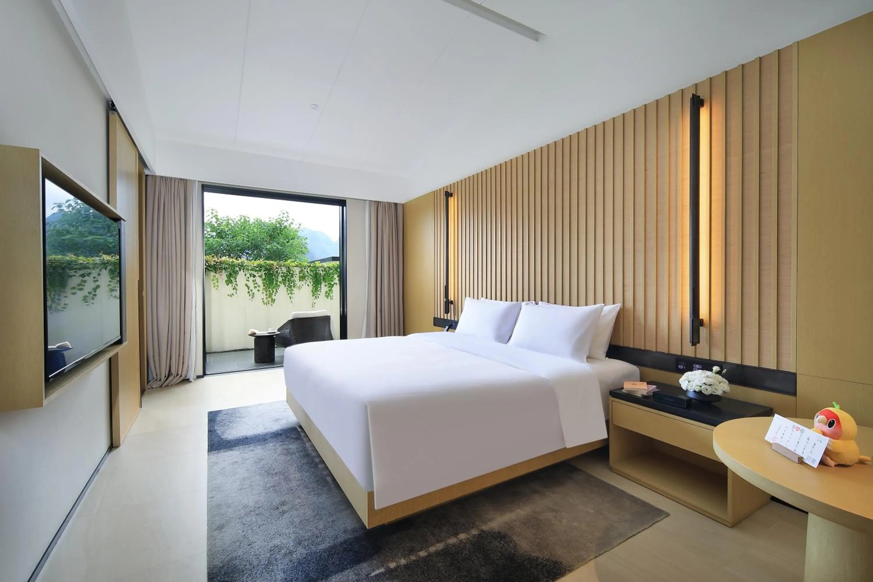 Photo of the whole room, Bed in Guilin Yangshuo Jora Hotel