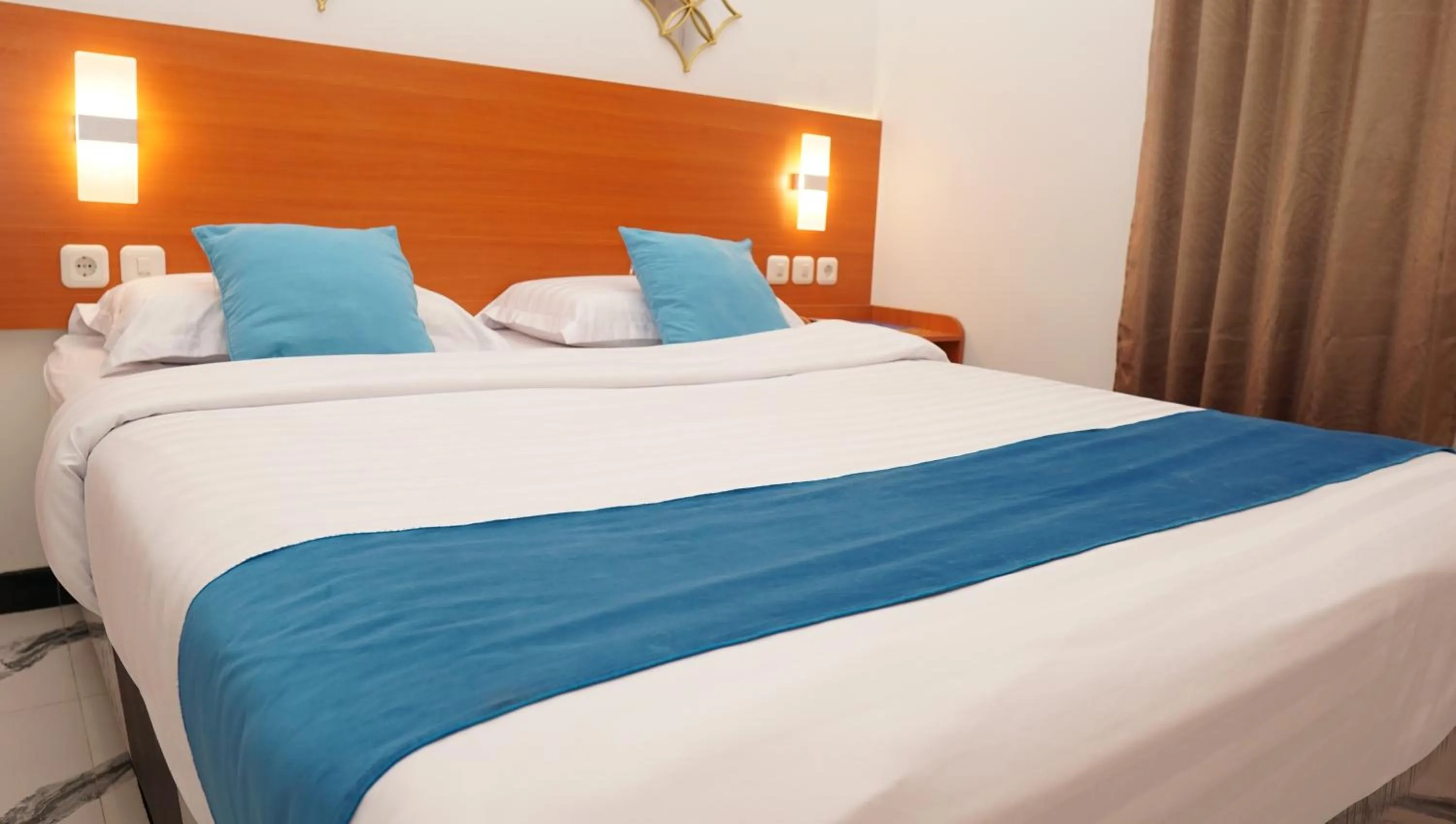 Bed in Jazz Room Kampung Inggris Syariah