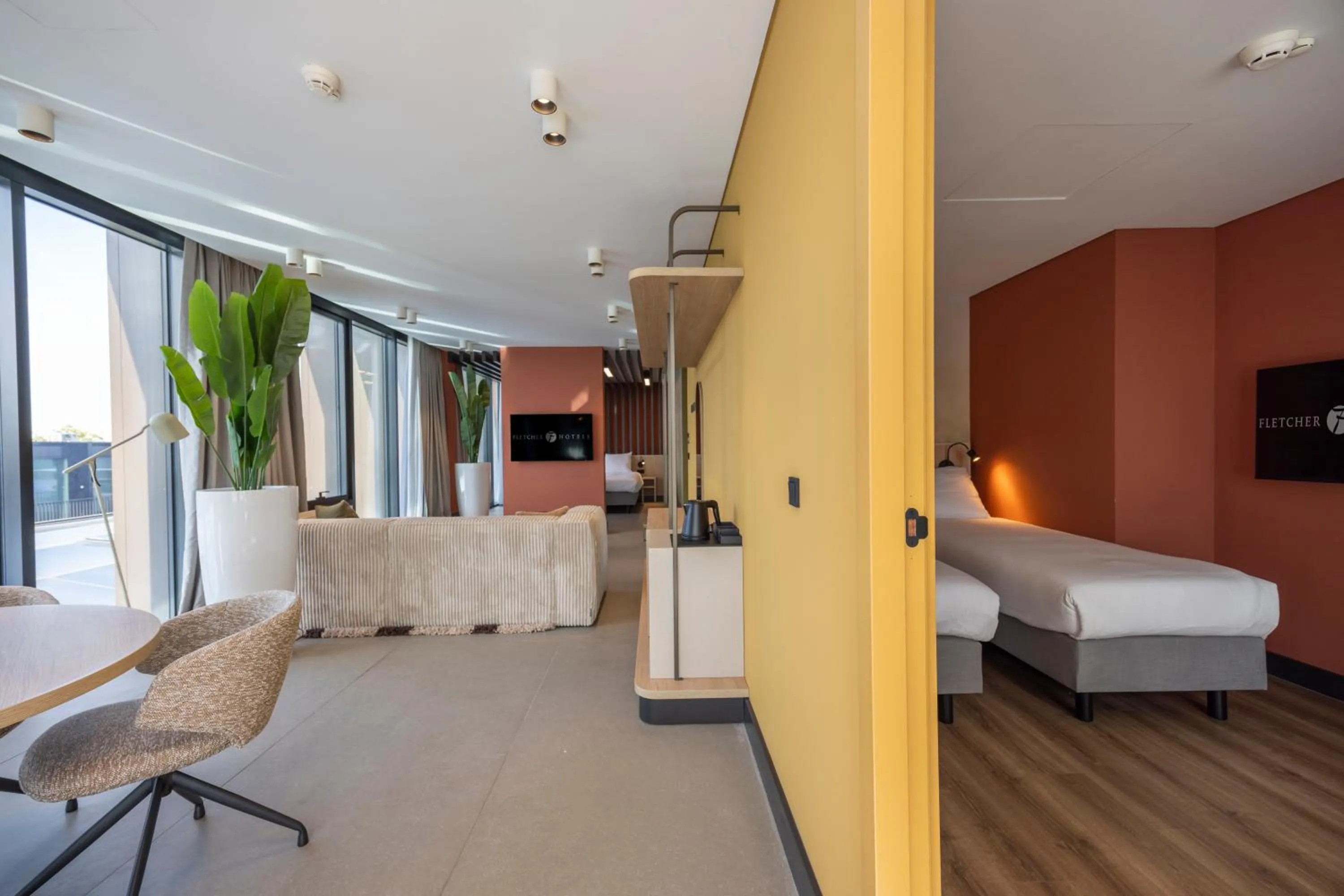 Living room, Bed in Fletcher Hotel-Restaurant Oisterwijk-Tilburg