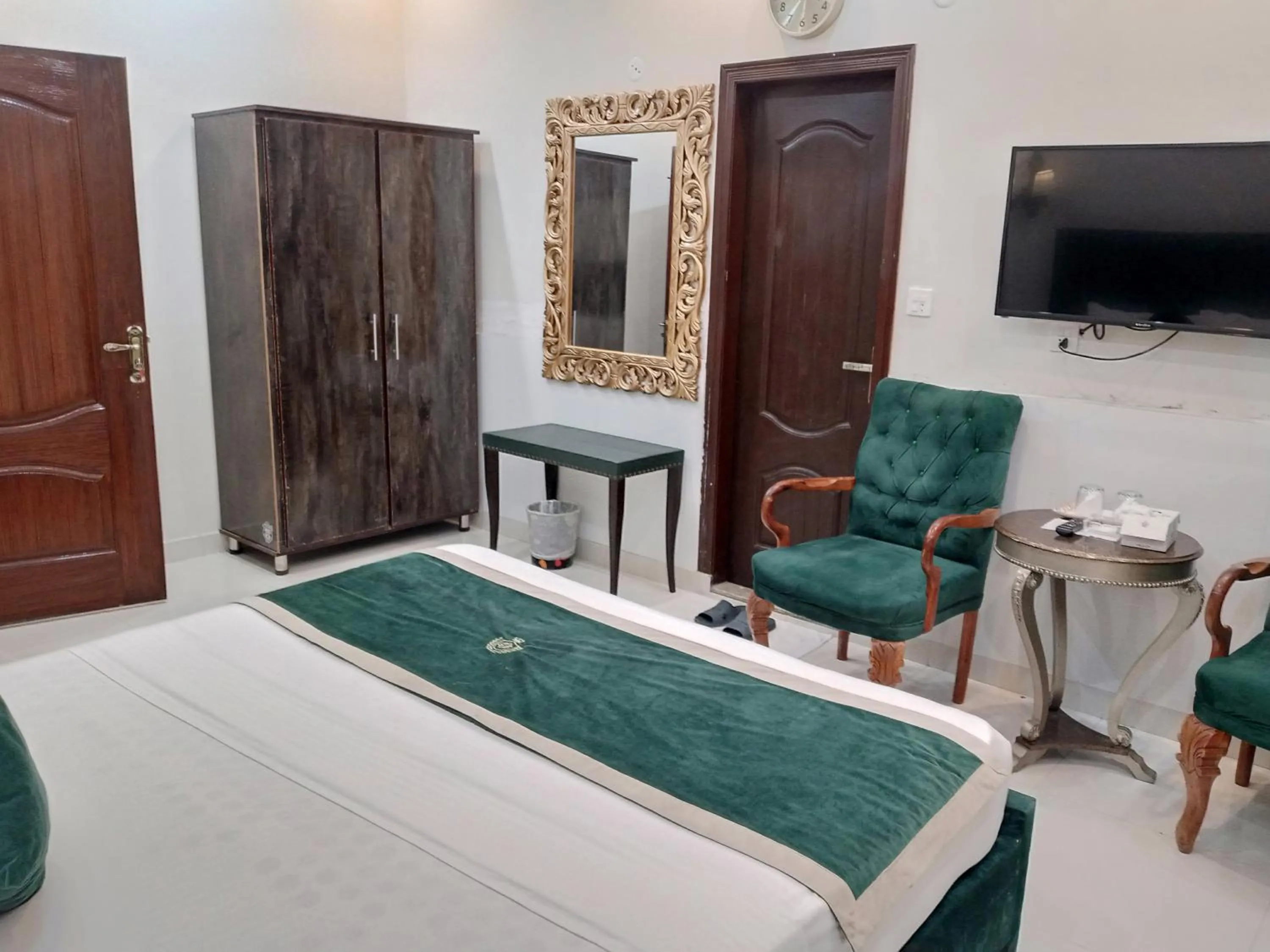 Seating area, Bed in Golden One Hotel