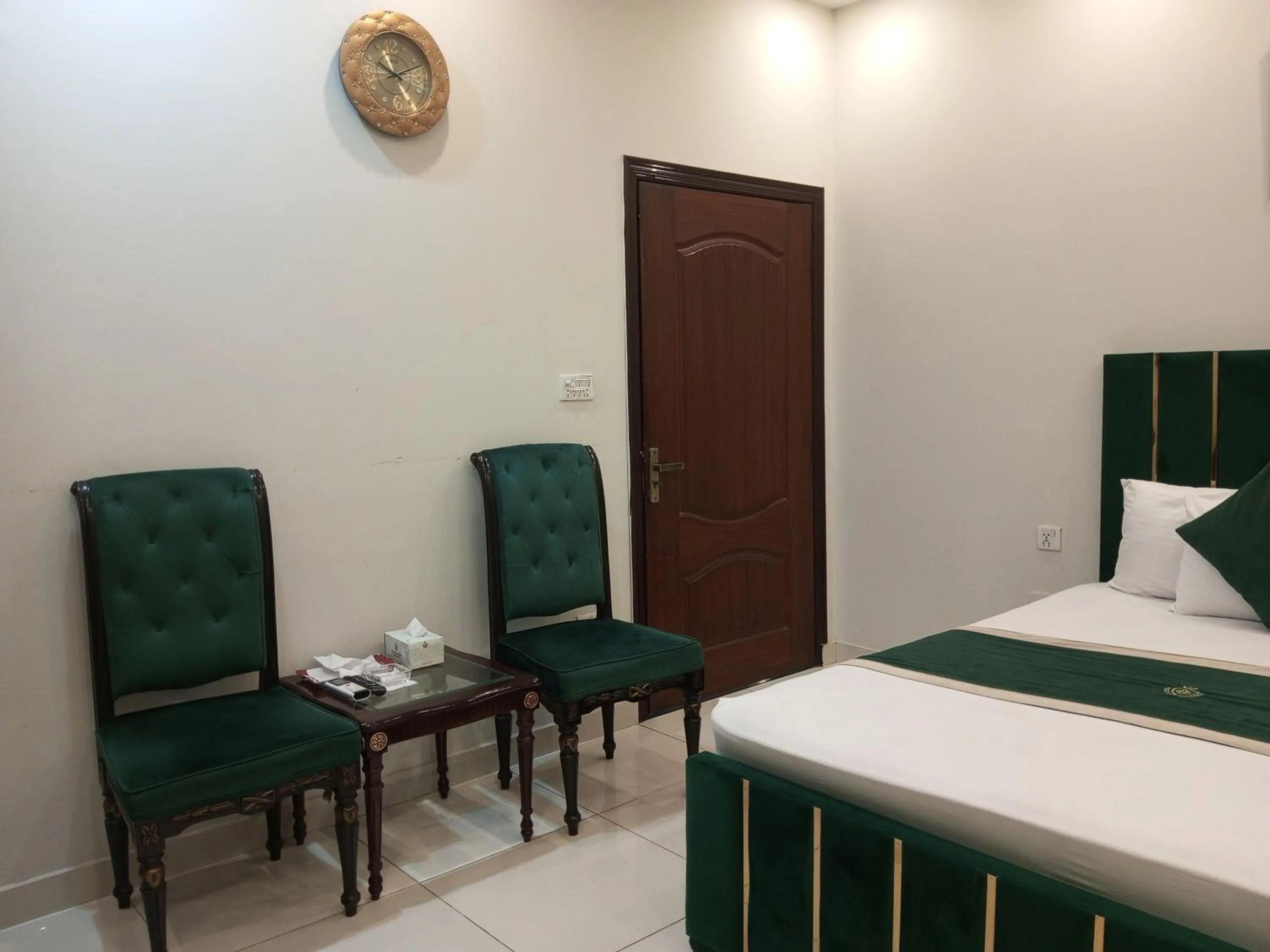 Seating area, Bed in Golden One Hotel