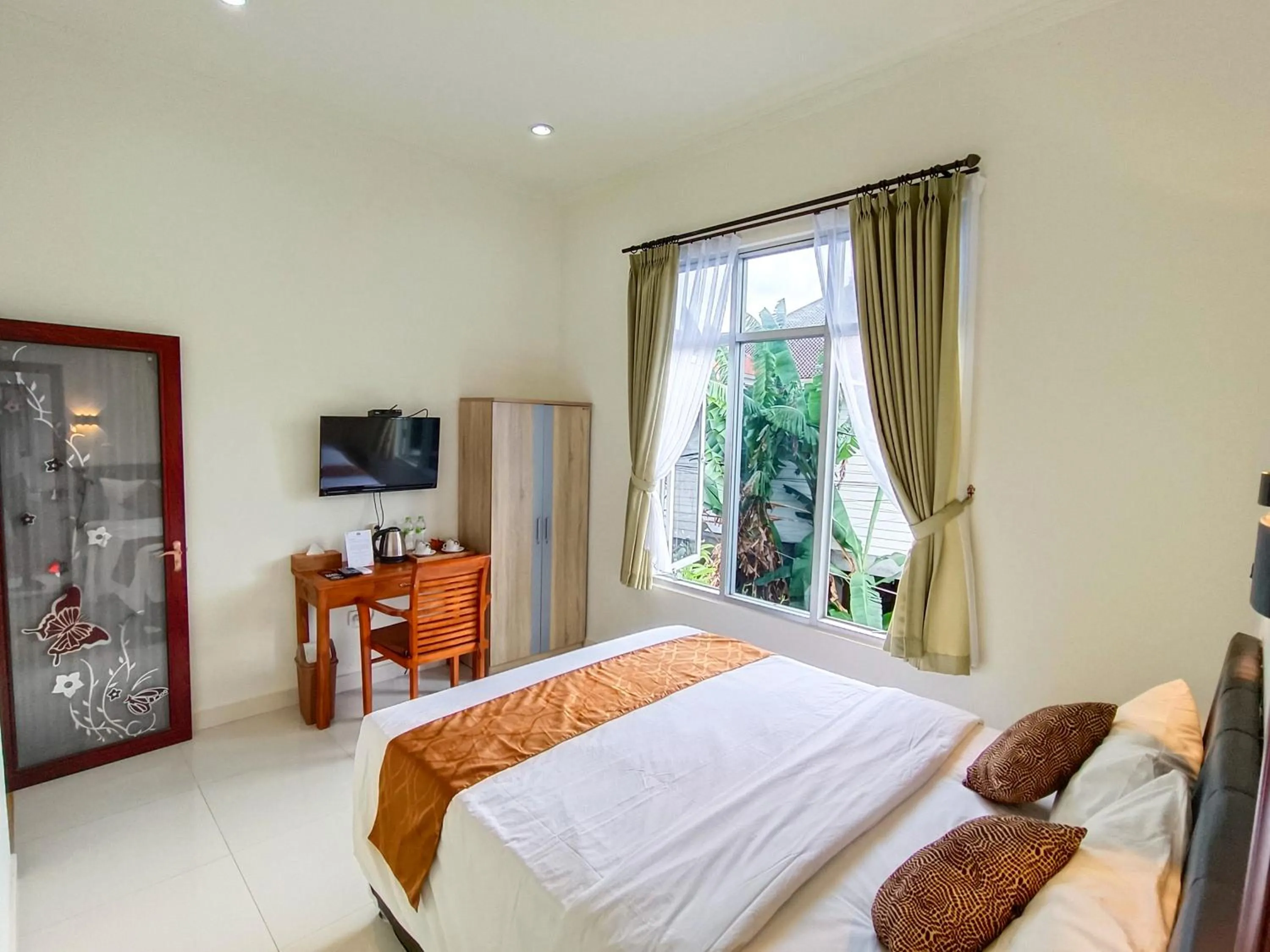 TV and multimedia, Bed in The Tunjung Boutique Resort