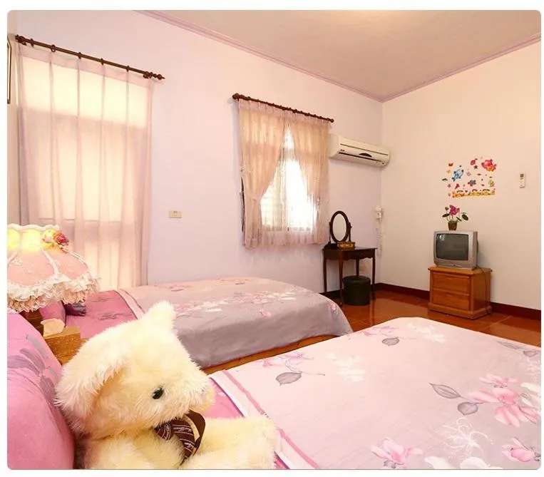 Bed in Yilan Xiang Feng Homestay