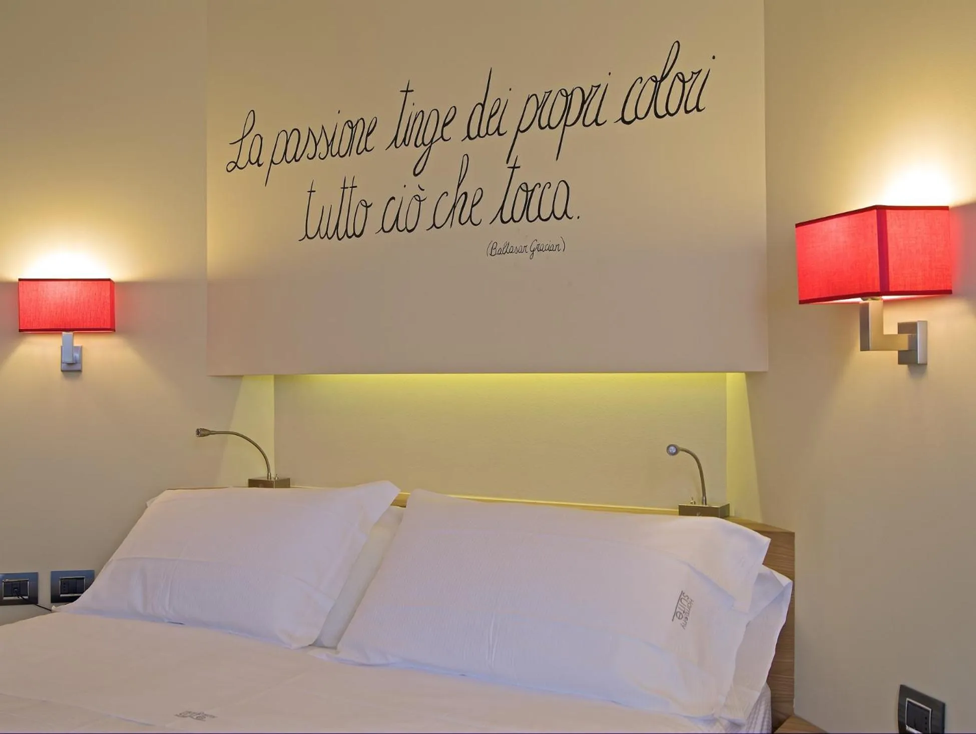 Bed in Harmony Suite Hotel