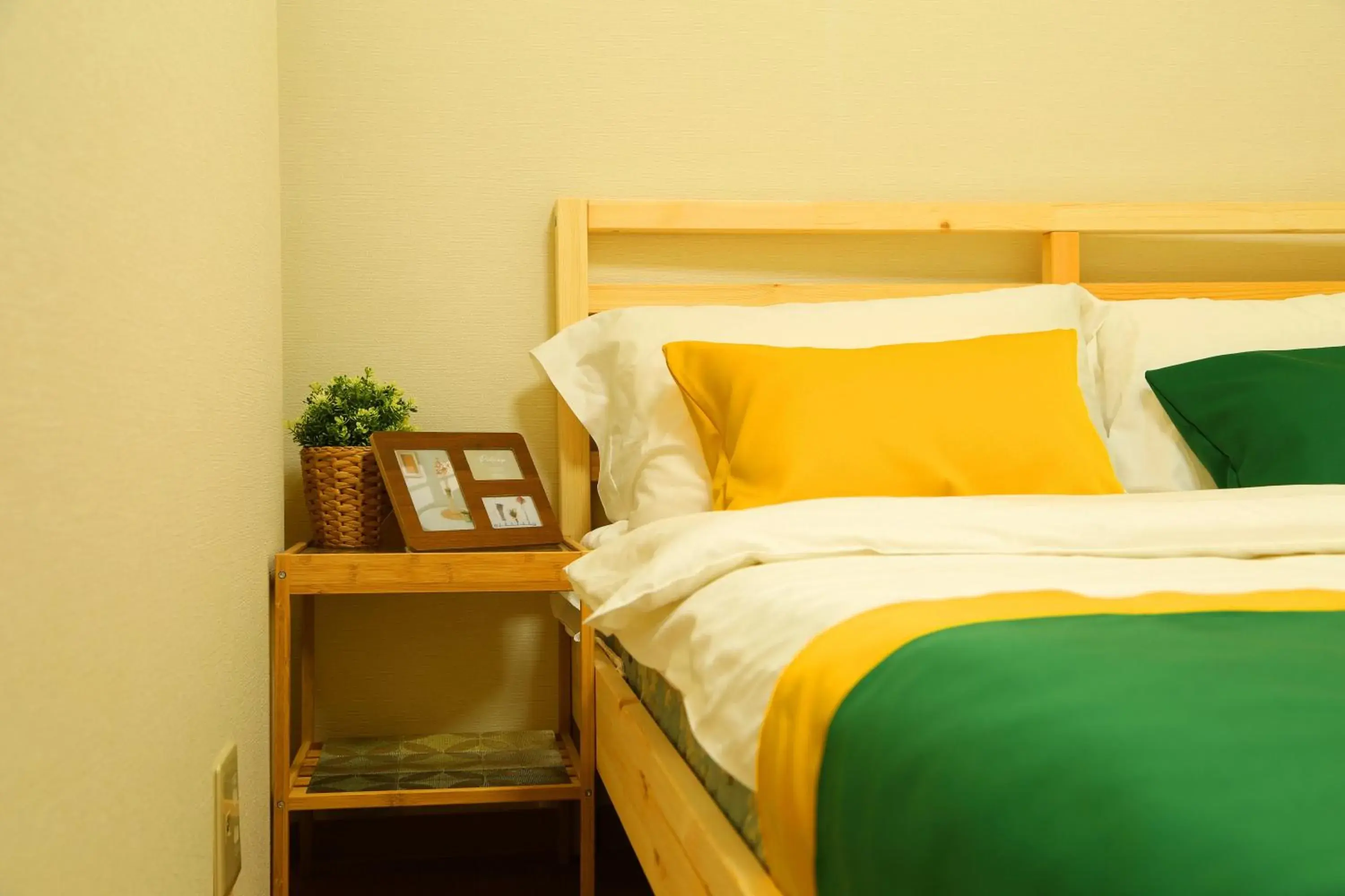 Bed in E JOY INN-West Shinjuku Branch Bed in E JOY INN-West Shinjuku Branch