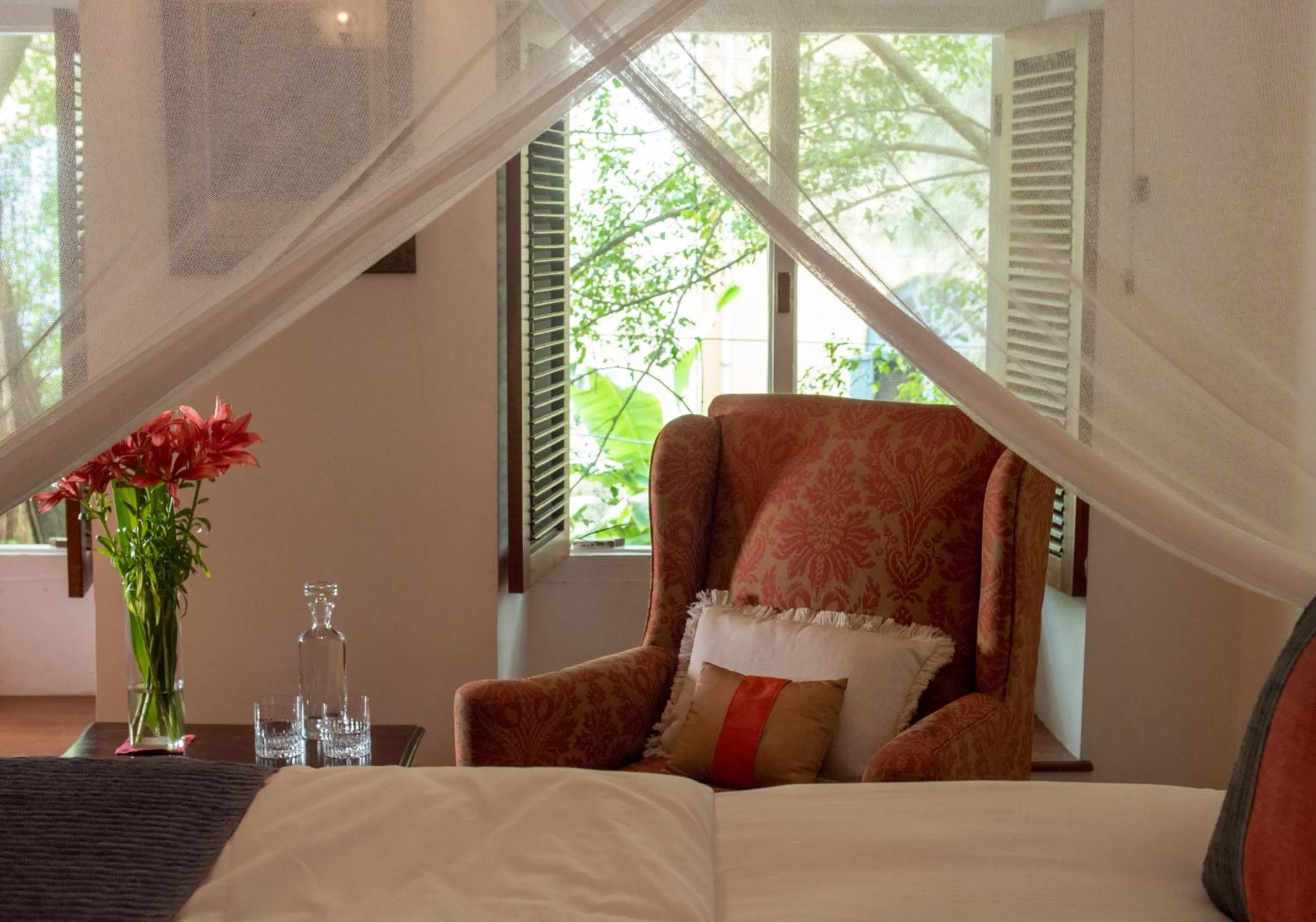 Seating area, Bed in Le Colonial 1506 - Exclusive Luxury Hideaway