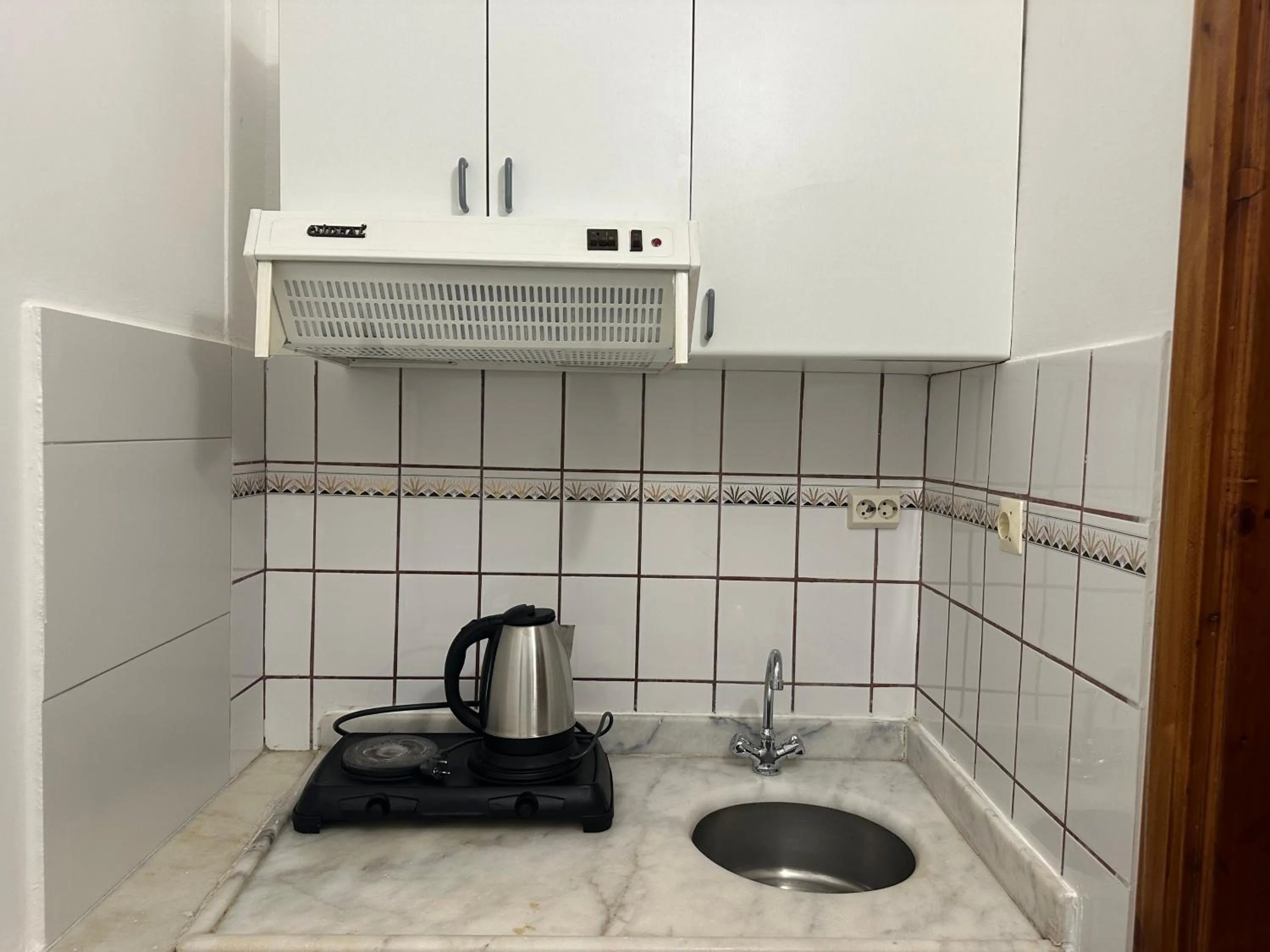 Kitchen or kitchenette in NATURELLA APART HOTEL