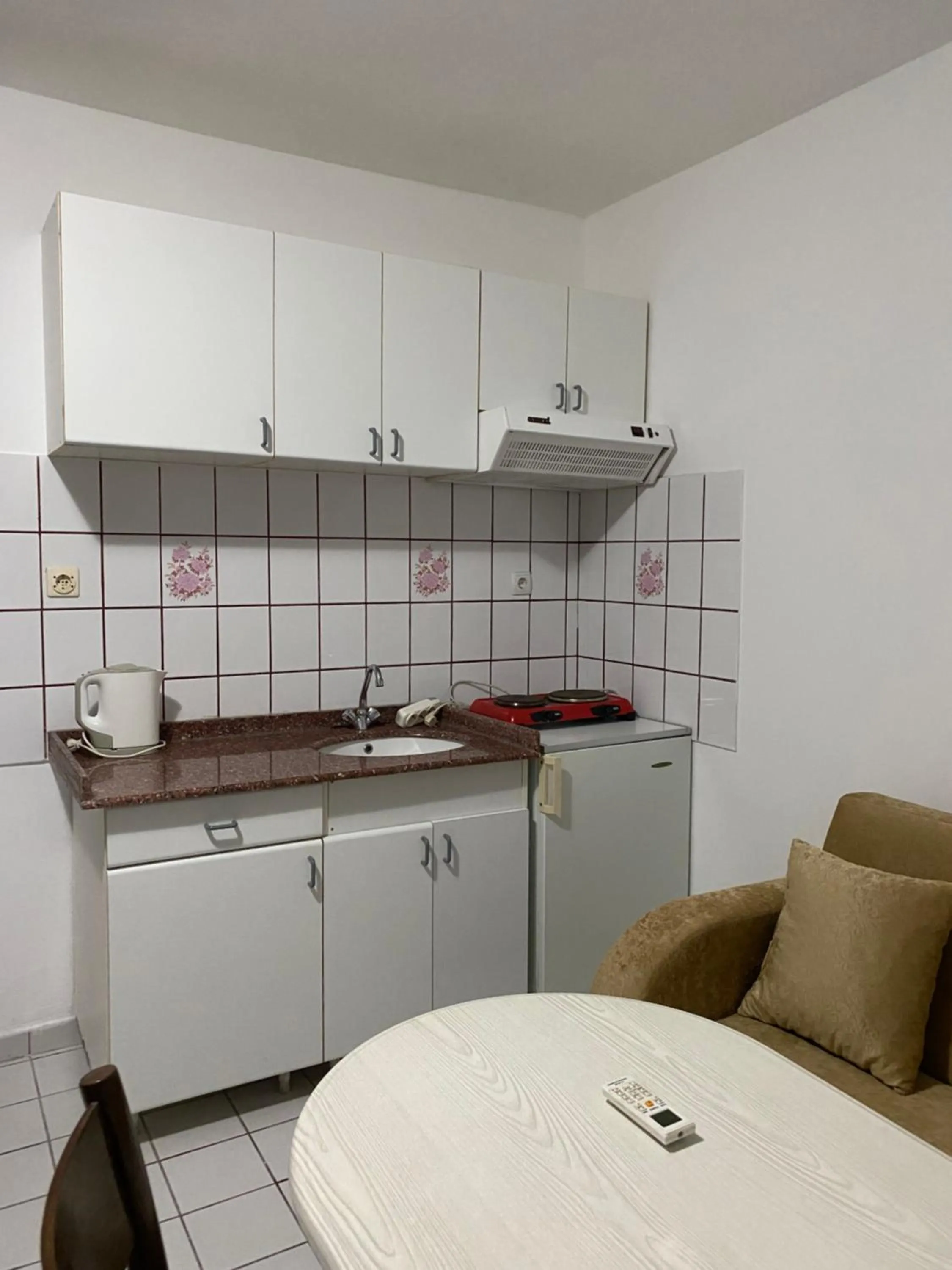 Kitchen or kitchenette in NATURELLA APART HOTEL