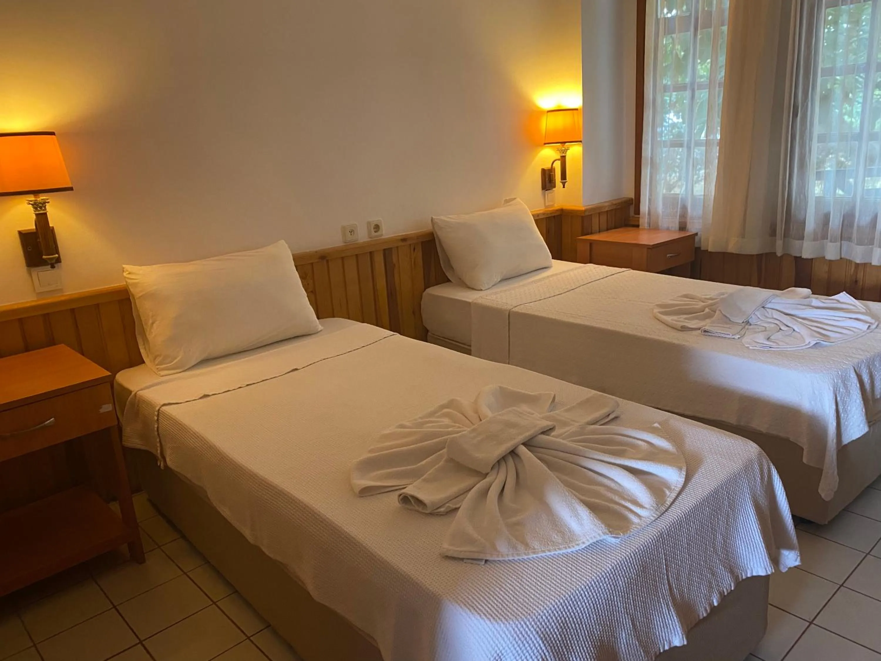 Bed in NATURELLA APART HOTEL