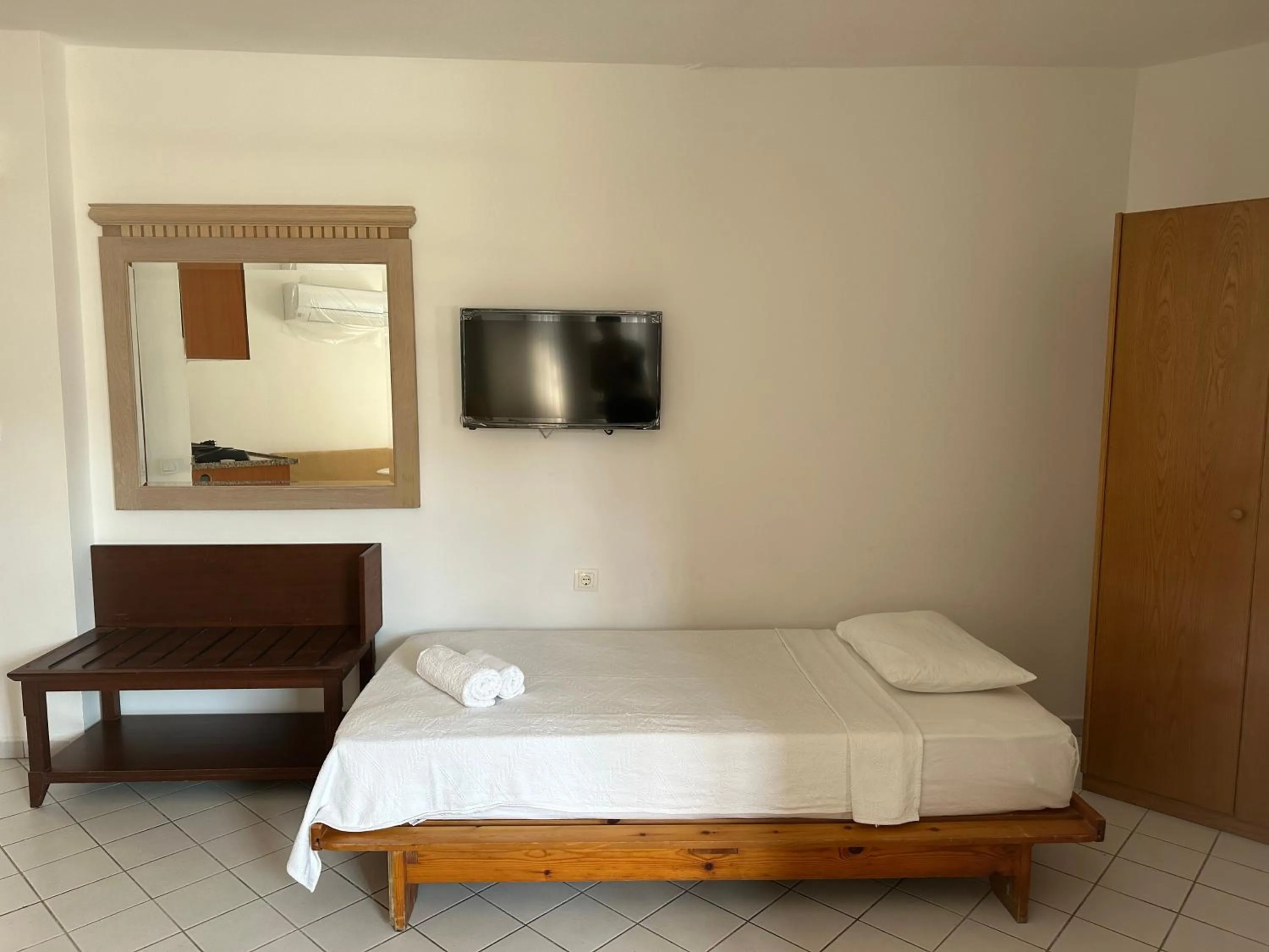 Bed in NATURELLA APART HOTEL