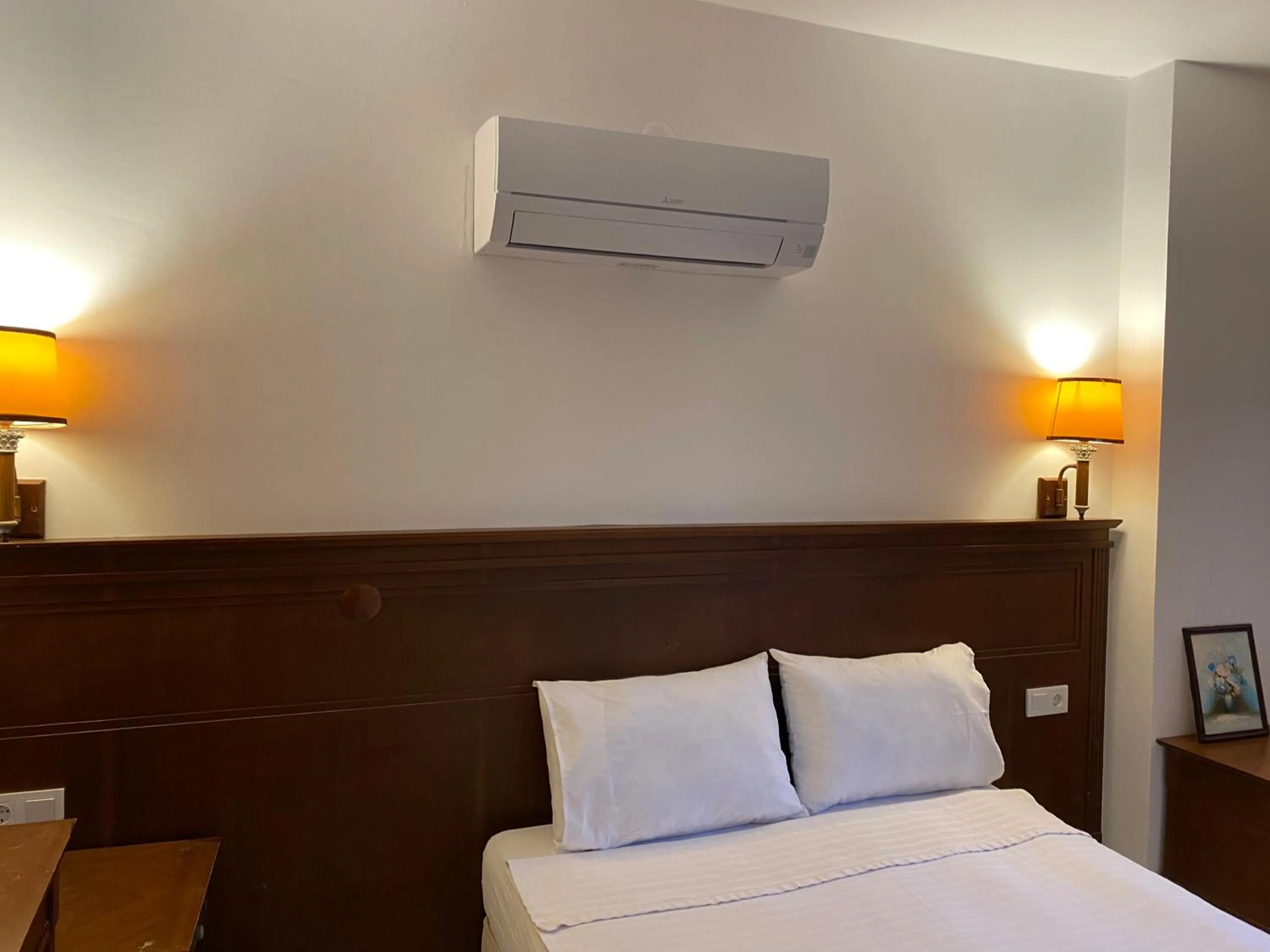 Bed in NATURELLA APART HOTEL